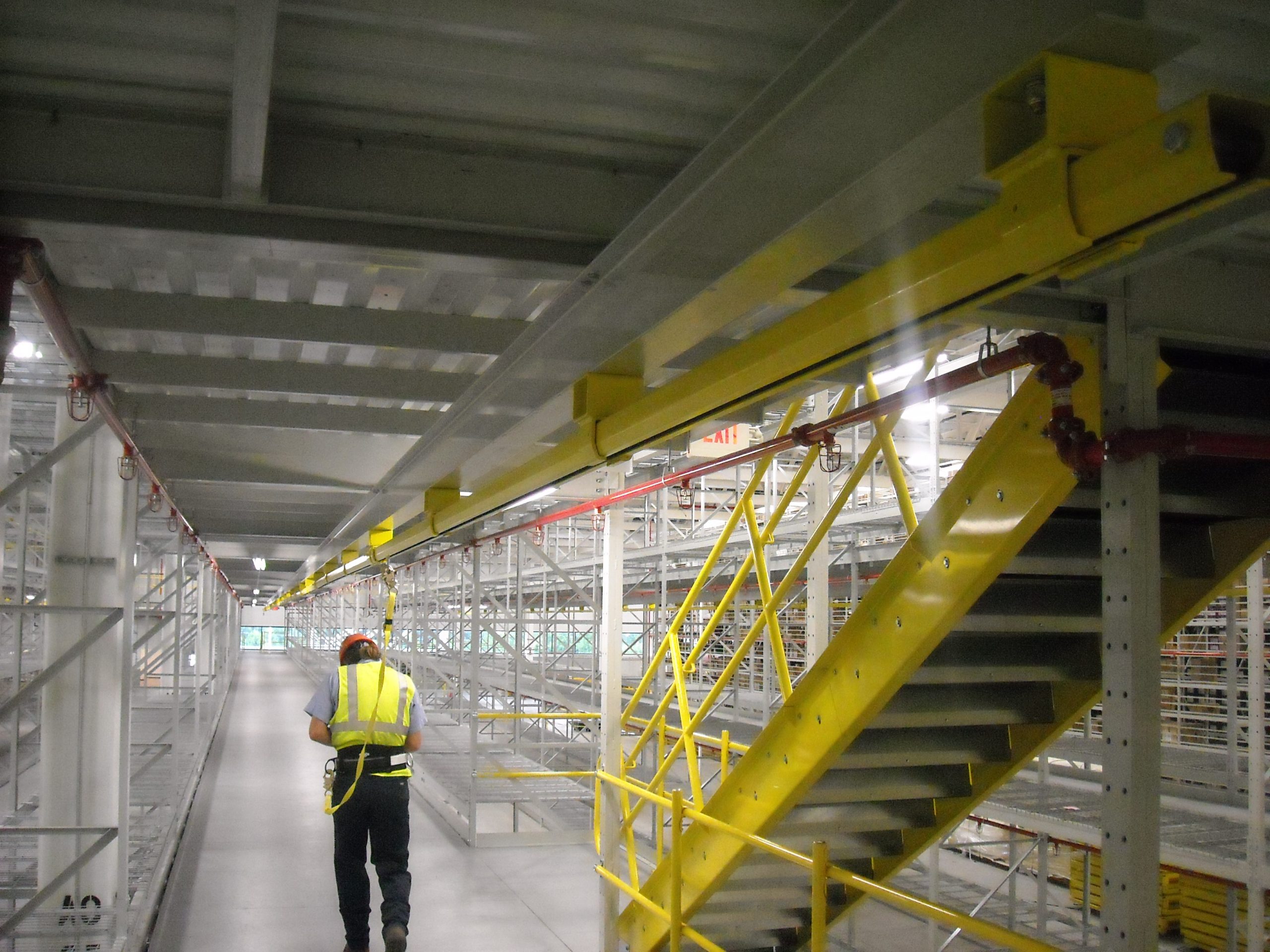 Engineered travel restraint system on industrial rooftop
