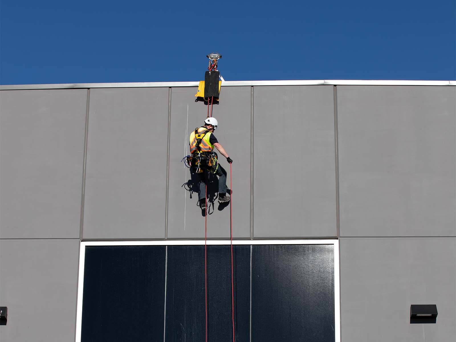 Fall protection guardrail system installed on commercial building rooftop