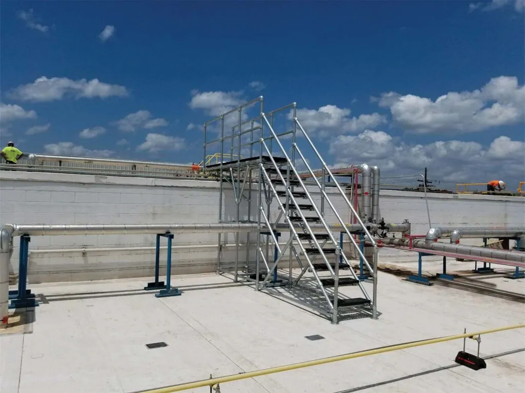 Crossover platform providing safe elevated walkway over equipment or obstacles