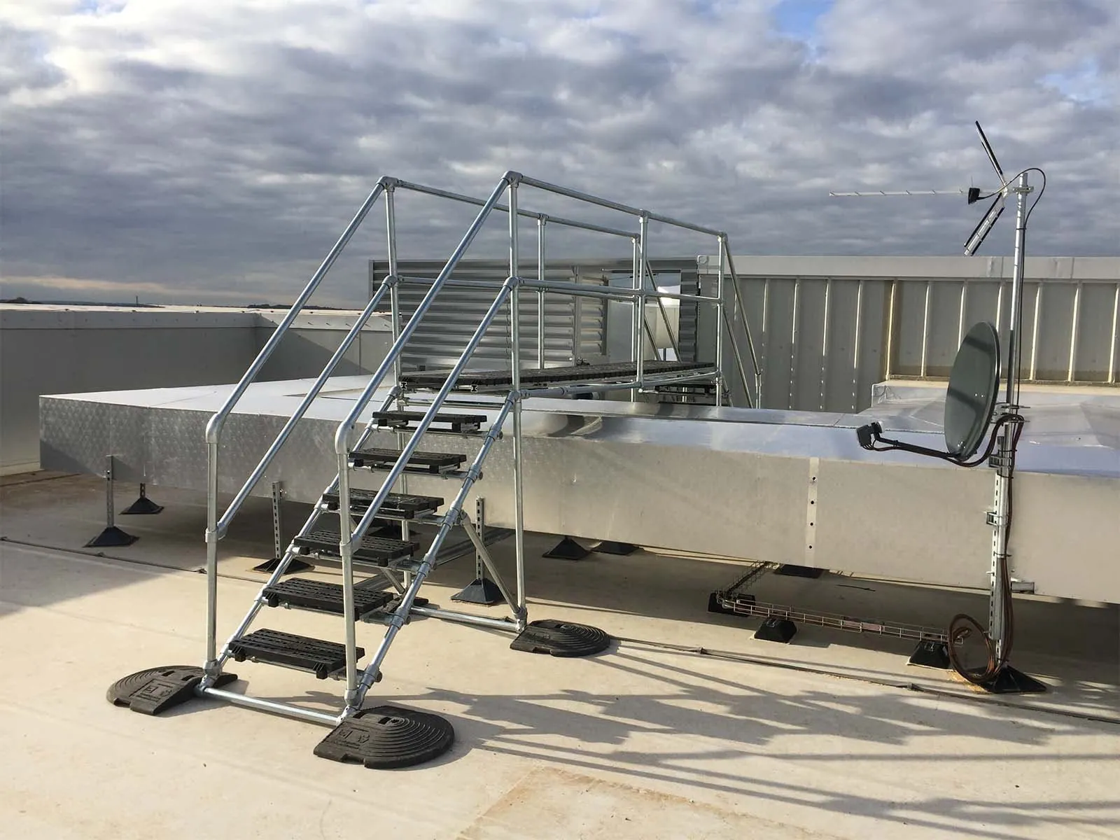 Crossover platform providing safe elevated walkway over equipment or obstacles