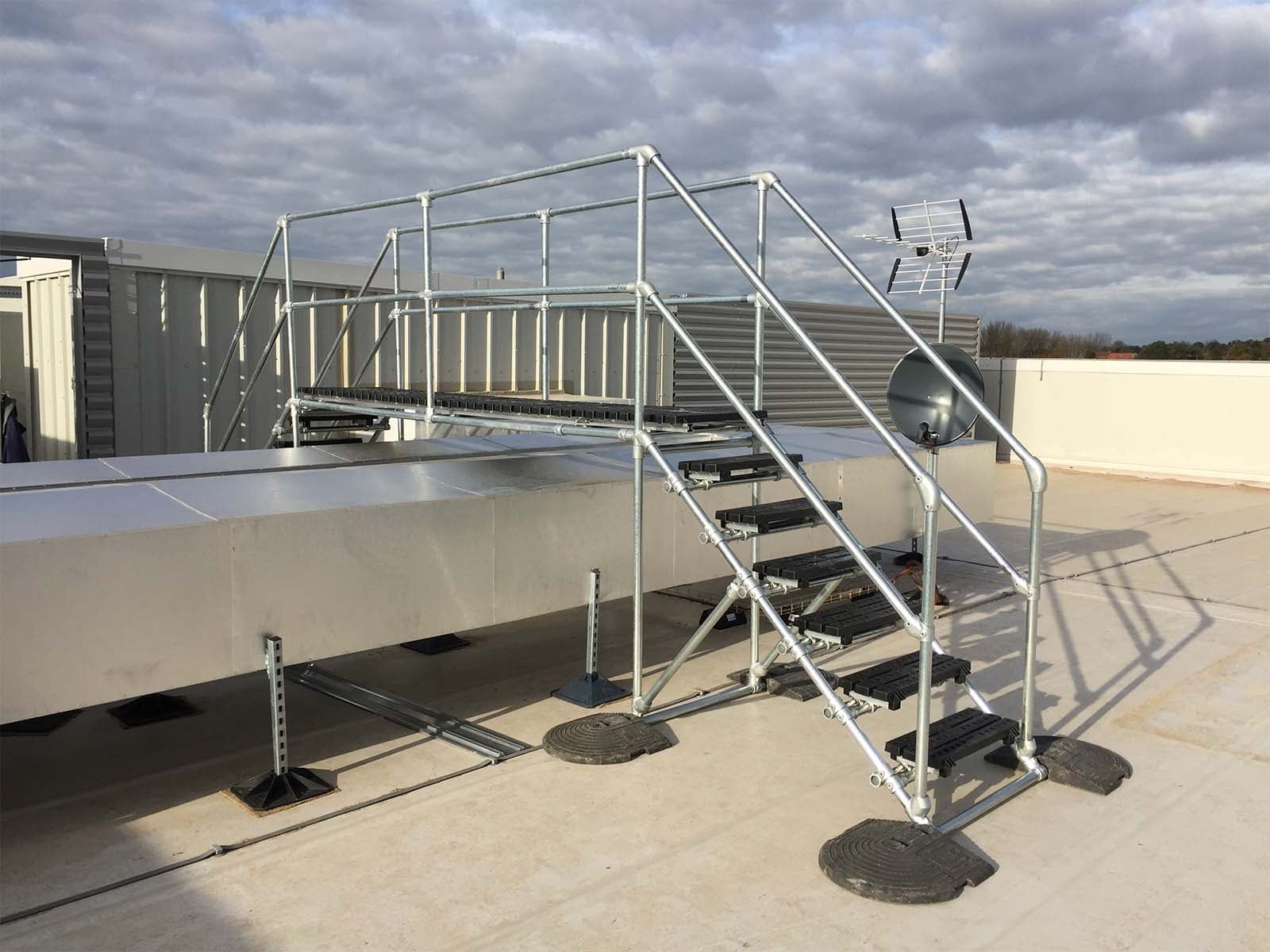 Crossover platform providing safe elevated walkway over equipment or obstacles