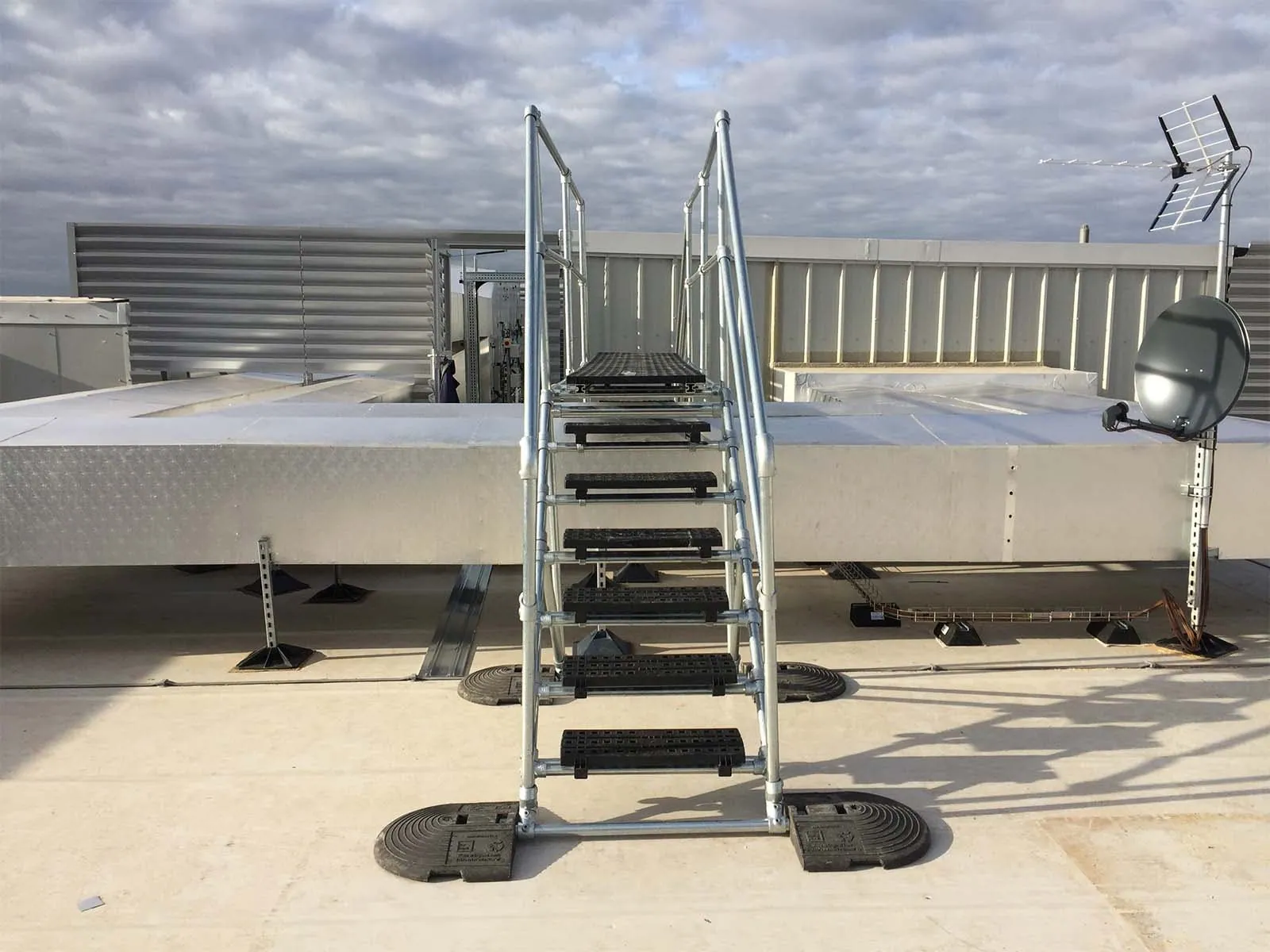 Crossover platform providing safe elevated walkway over equipment or obstacles