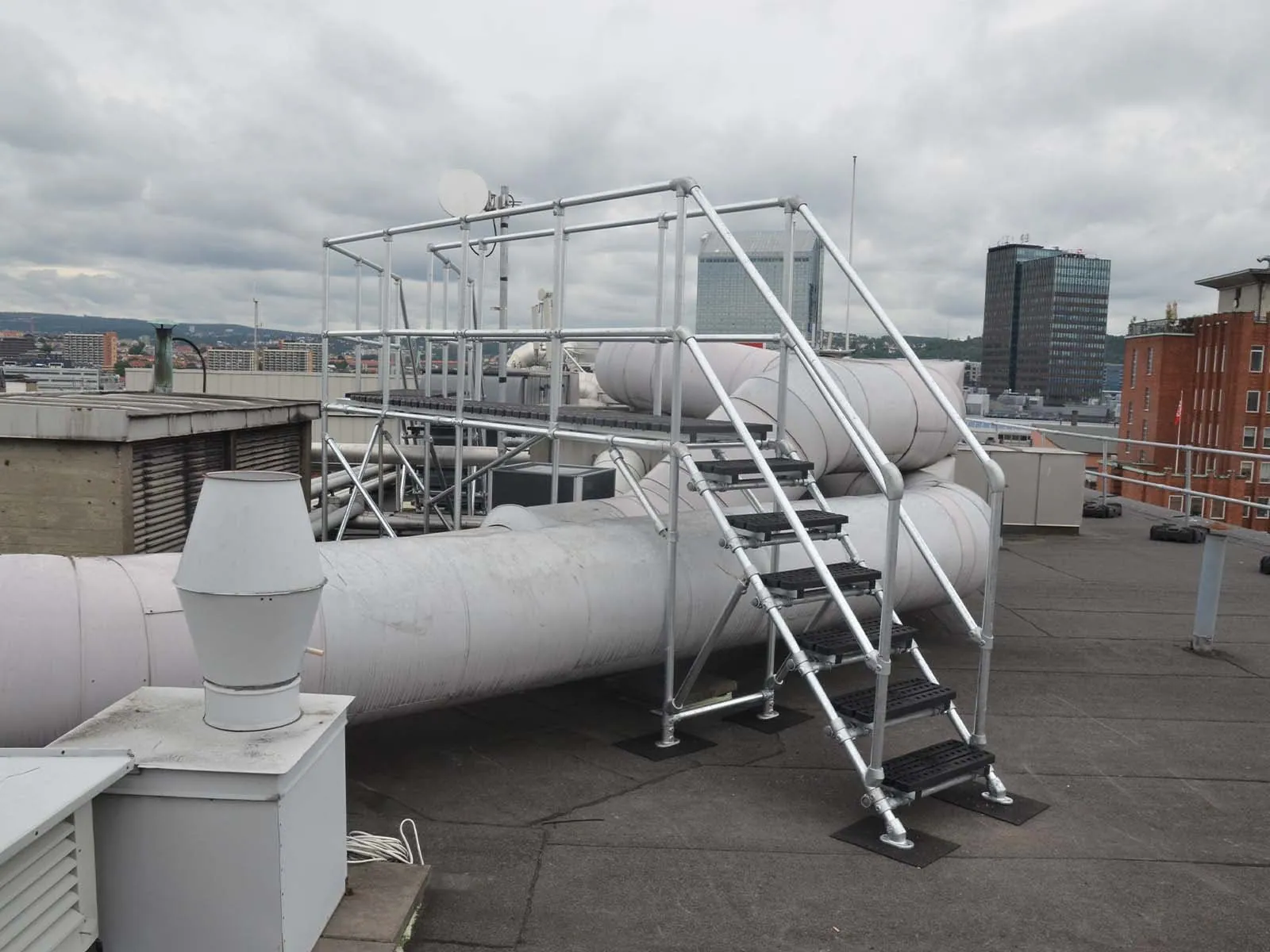 Crossover platform providing safe elevated walkway over equipment or obstacles