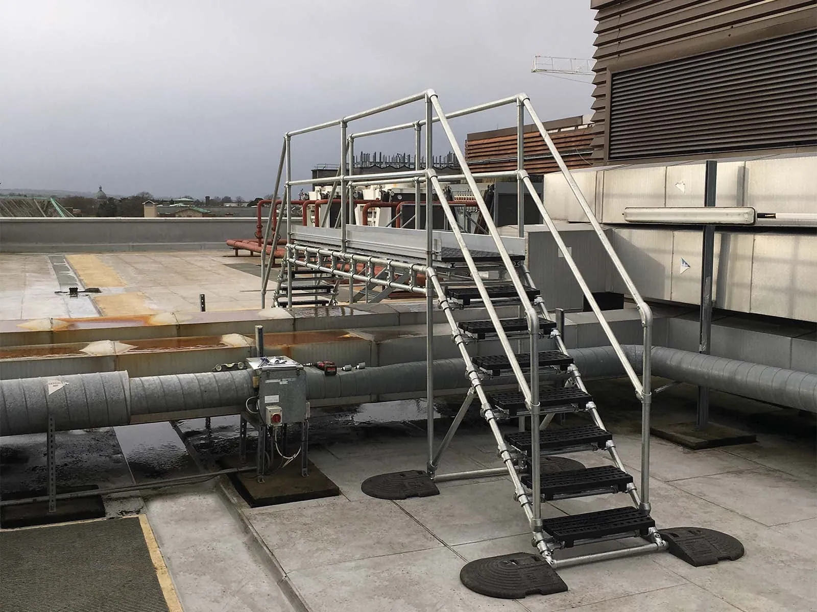 Crossover platform providing safe elevated walkway over equipment or obstacles