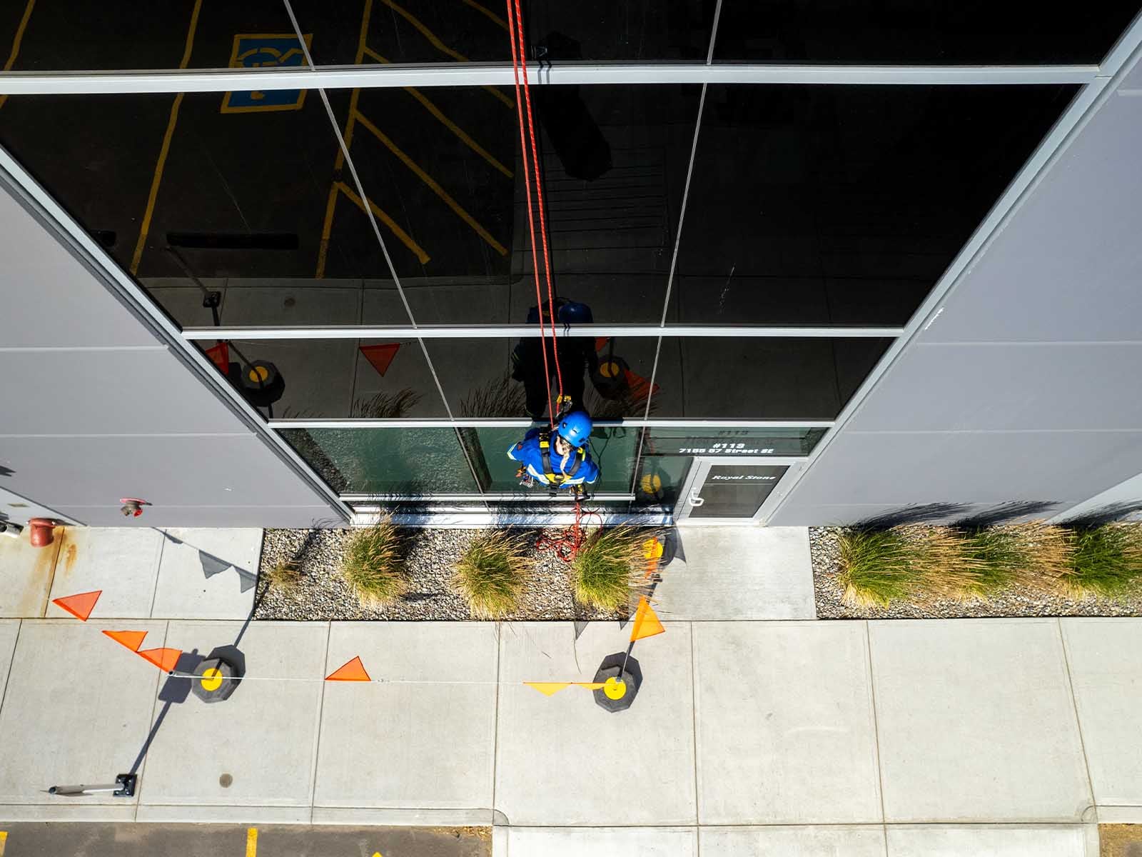 Fall protection system installed for safe access to building facade during maintenance