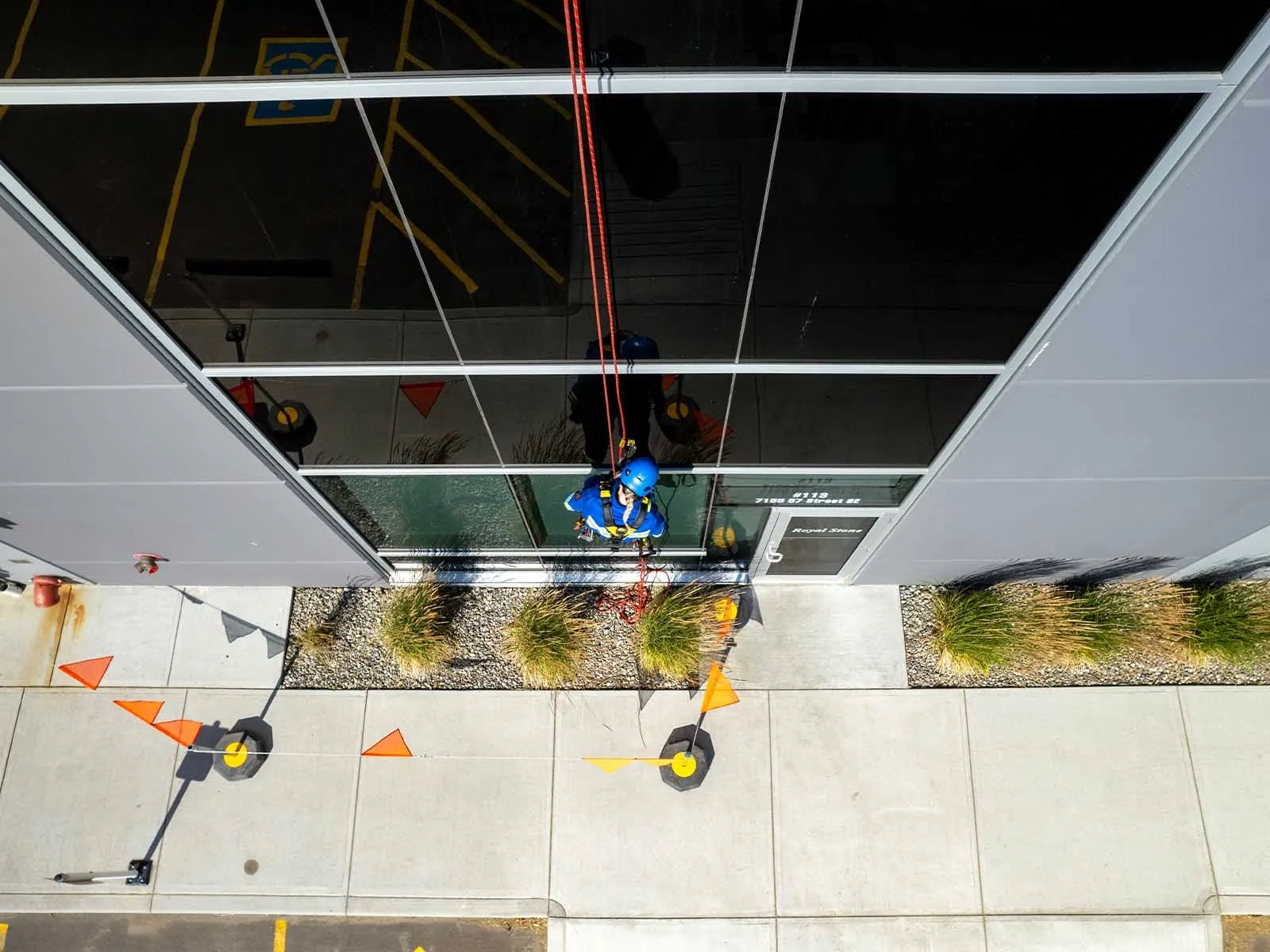 Fall protection system installed for safe access to building facade during maintenance