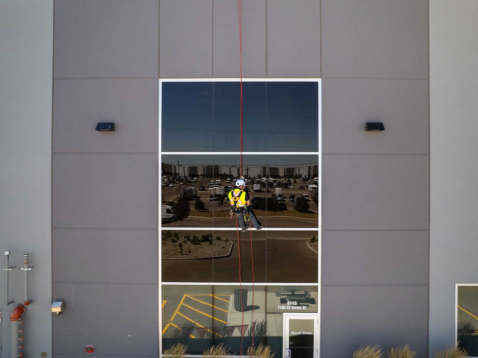 Fall protection system installed for safe access to building facade during maintenance