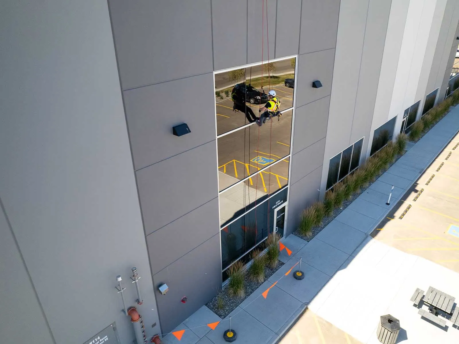 Fall protection system installed for safe access to building facade during maintenance