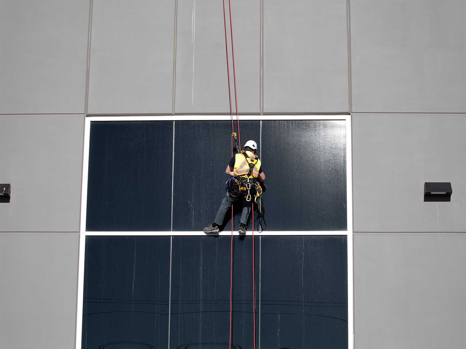 Fall protection system installed for safe access to building facade during maintenance