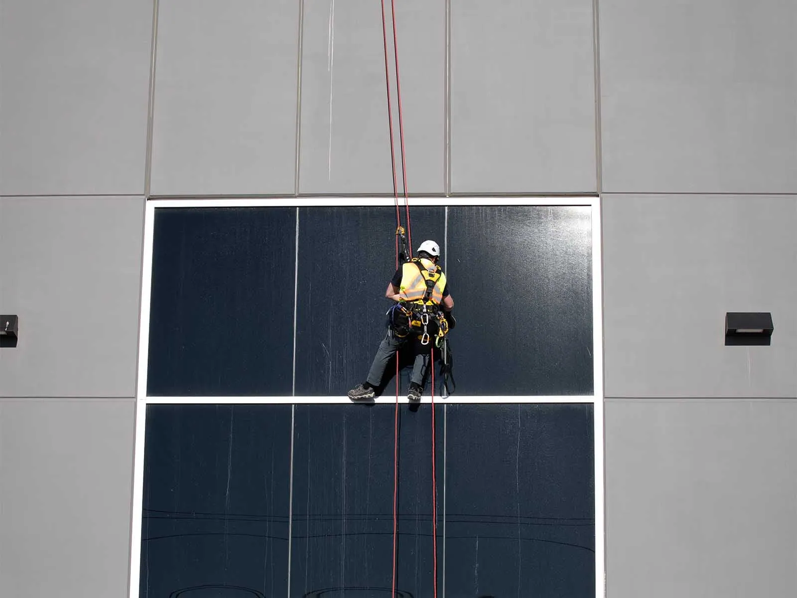 Fall protection system installed for safe access to building facade during maintenance