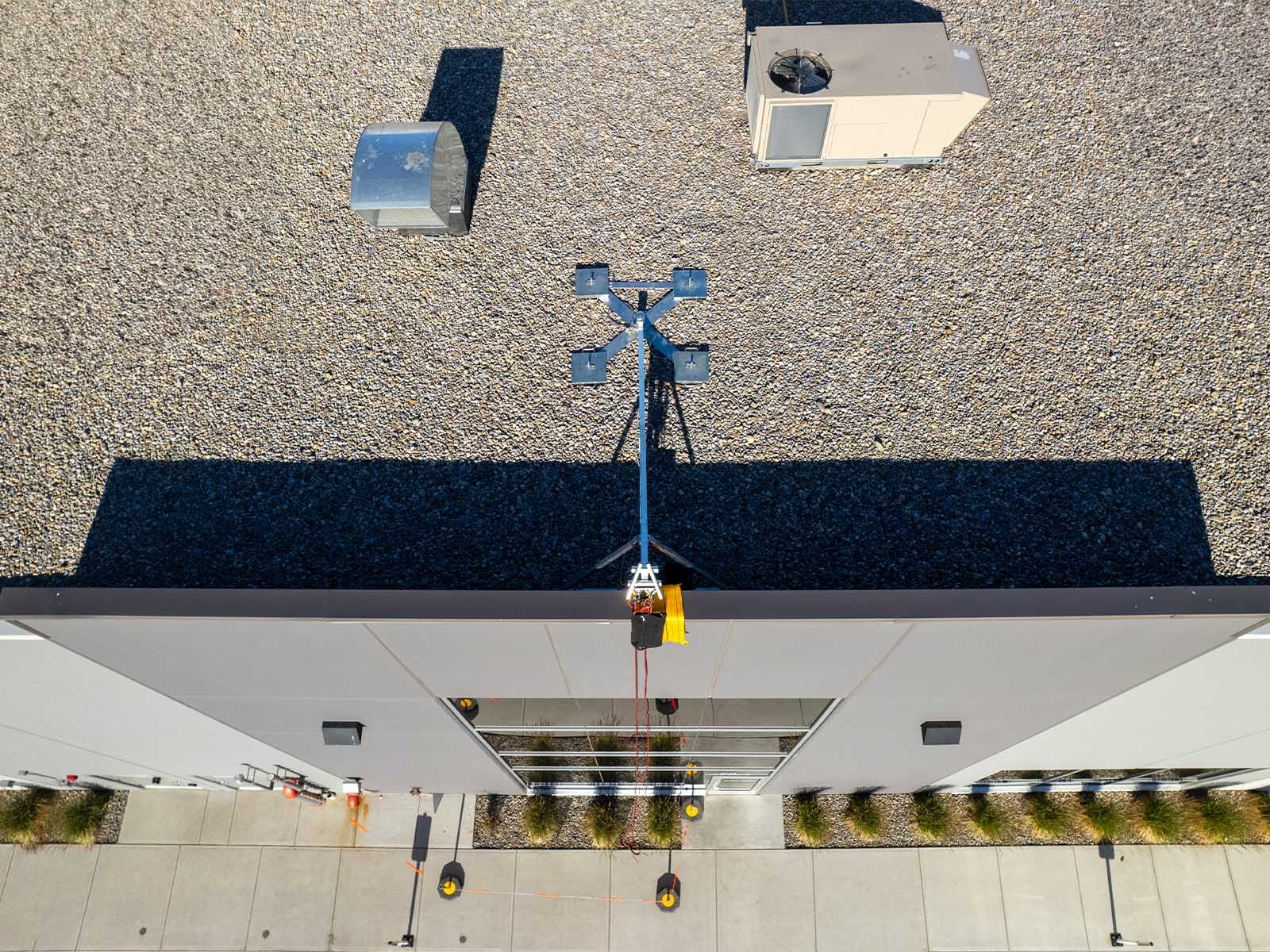 Fall protection system installed for safe access to building facade during maintenance