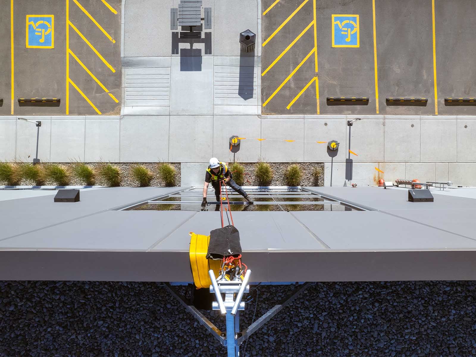 Fall protection system installed for safe access to building facade during maintenance