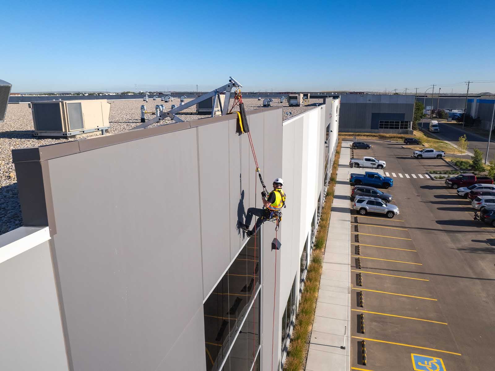 Fall protection system installed for safe access to building facade during maintenance