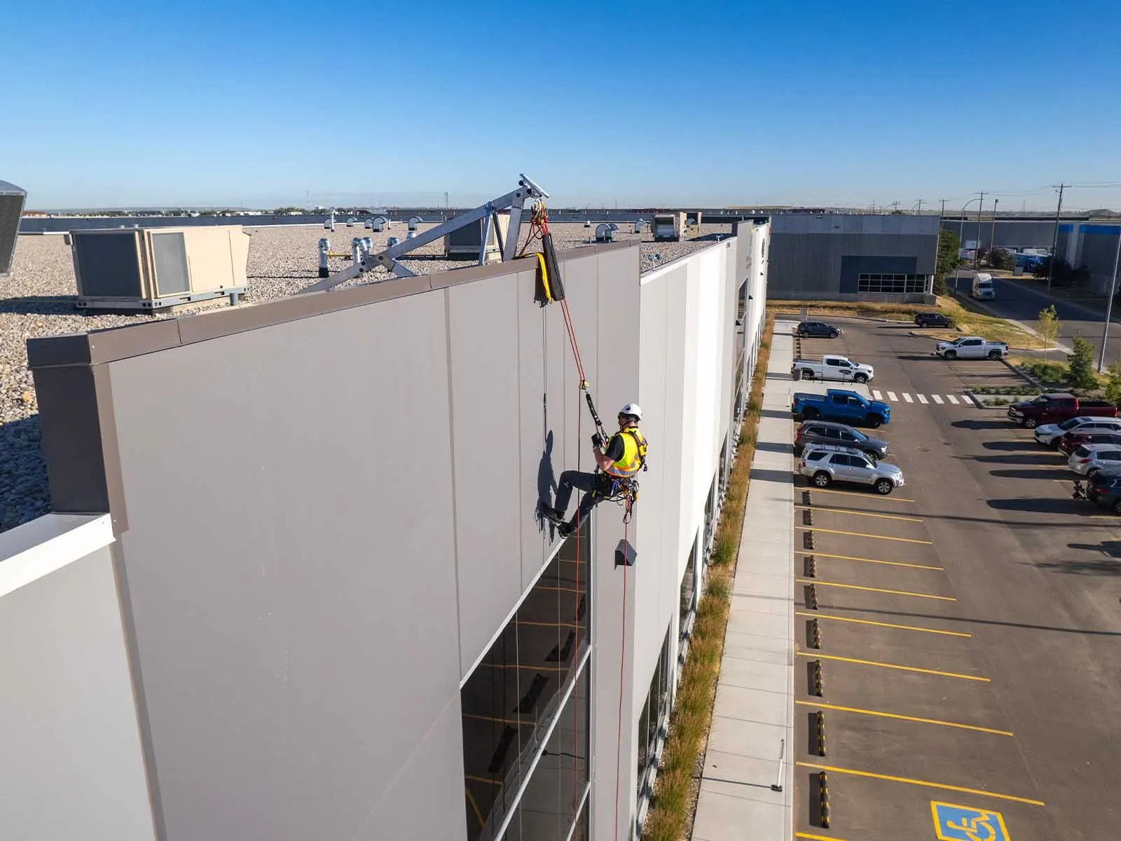 Fall protection system installed for safe access to building facade during maintenance