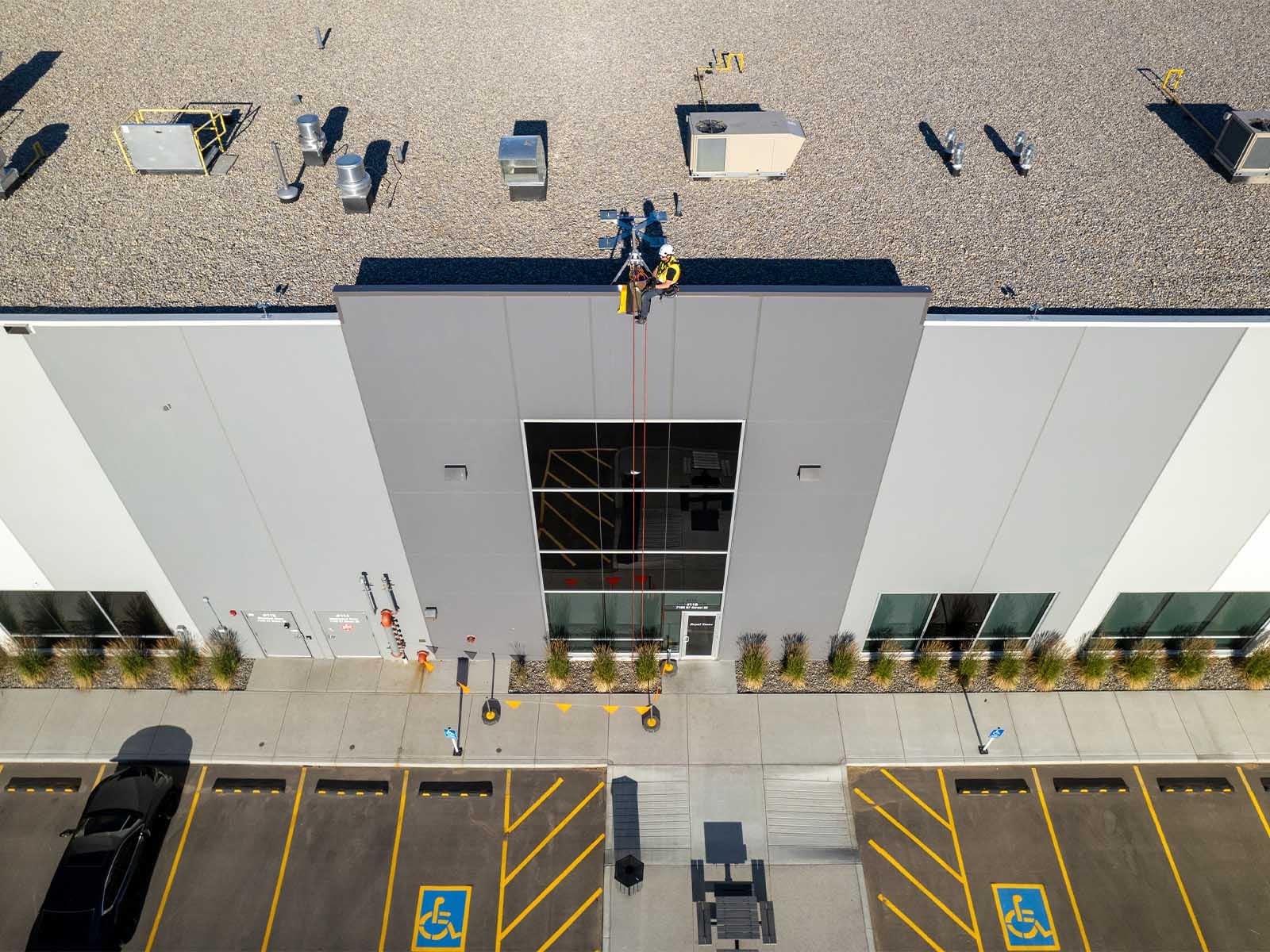 Fall protection system installed for safe access to building facade during maintenance