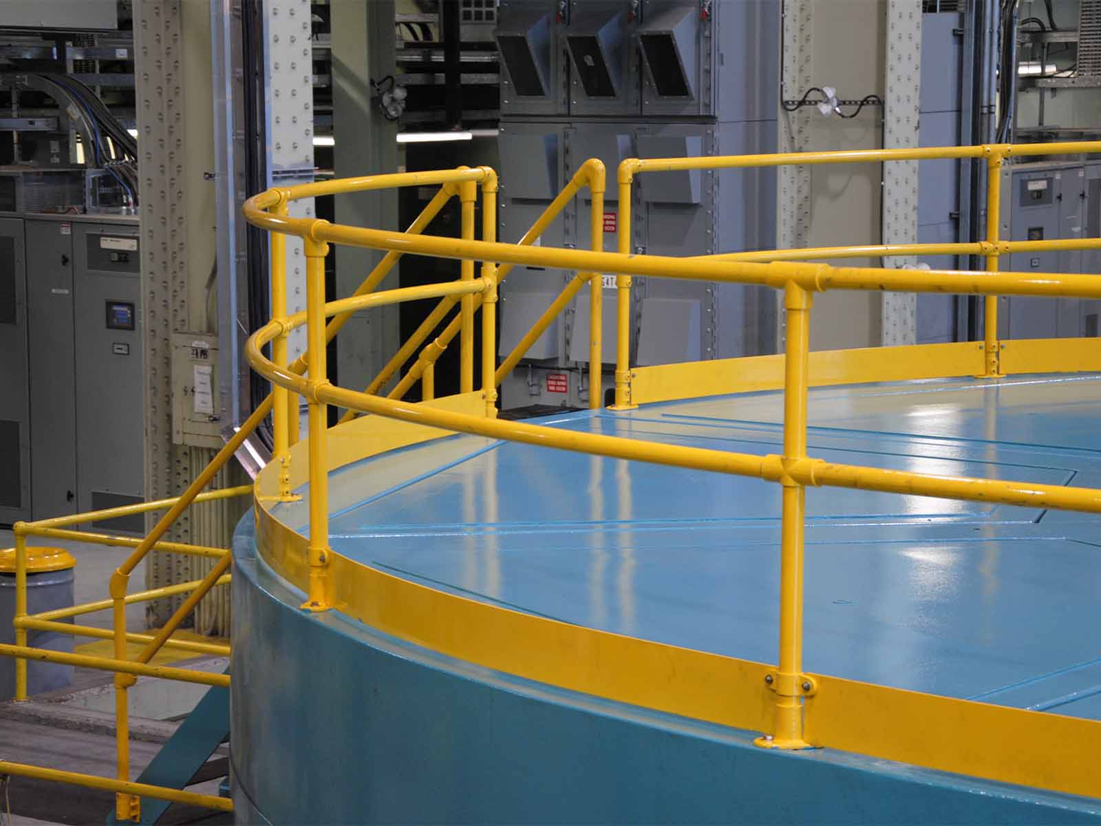 Ground-based guardrail system installed to provide fall protection at elevated work areas