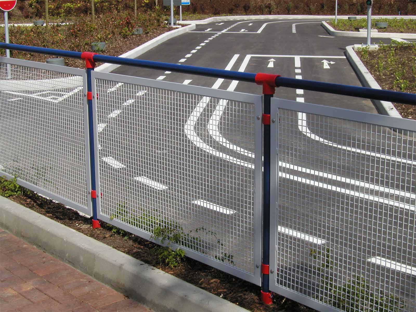Ground-based guardrail system installed to provide fall protection at elevated work areas