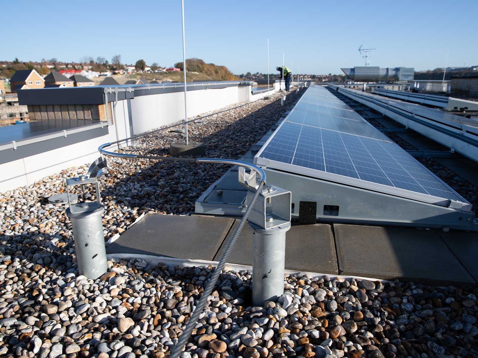 Horizontal lifeline system installed for continuous fall protection on rooftop