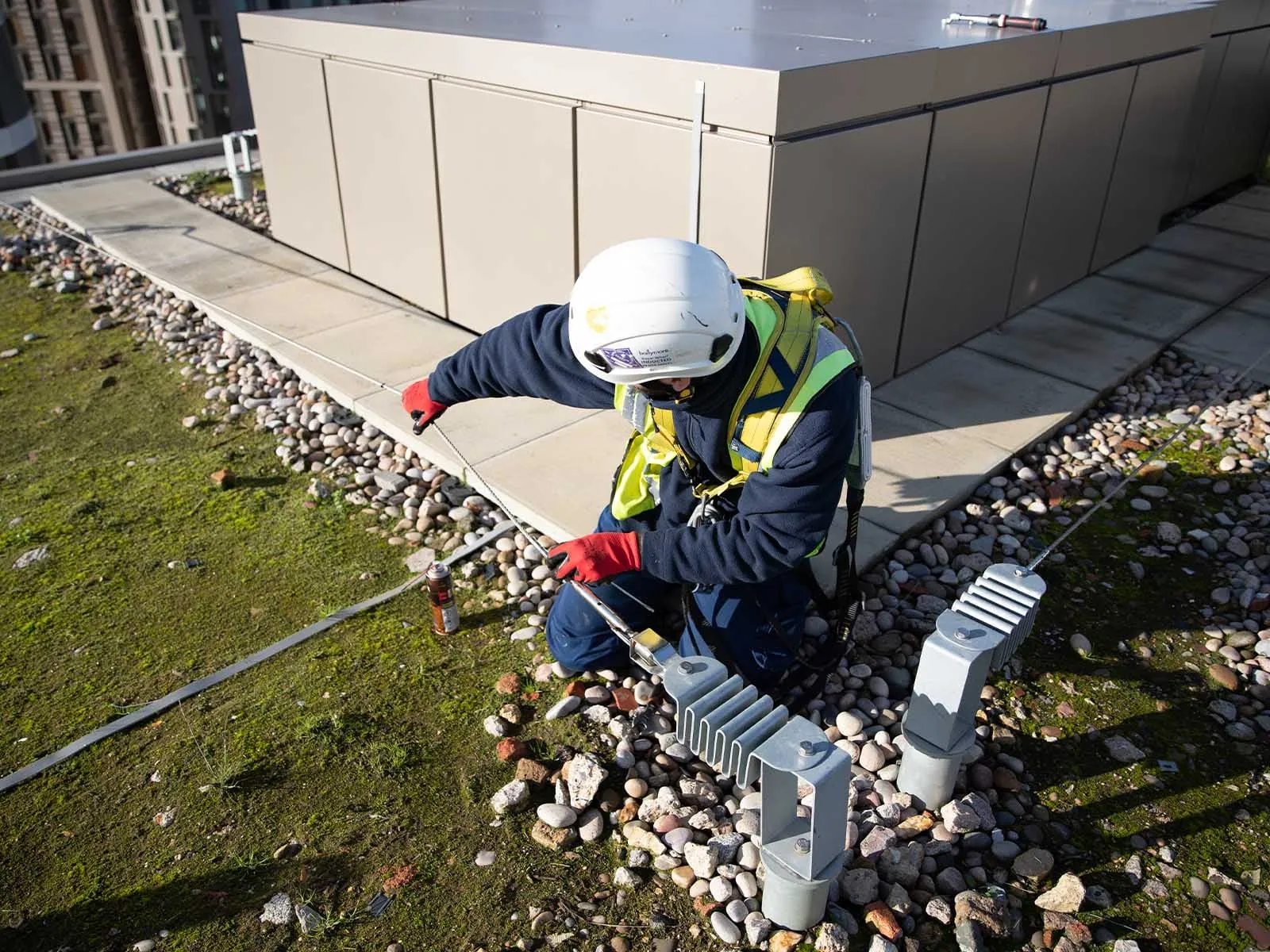 Horizontal lifeline system installed for continuous fall protection on rooftop