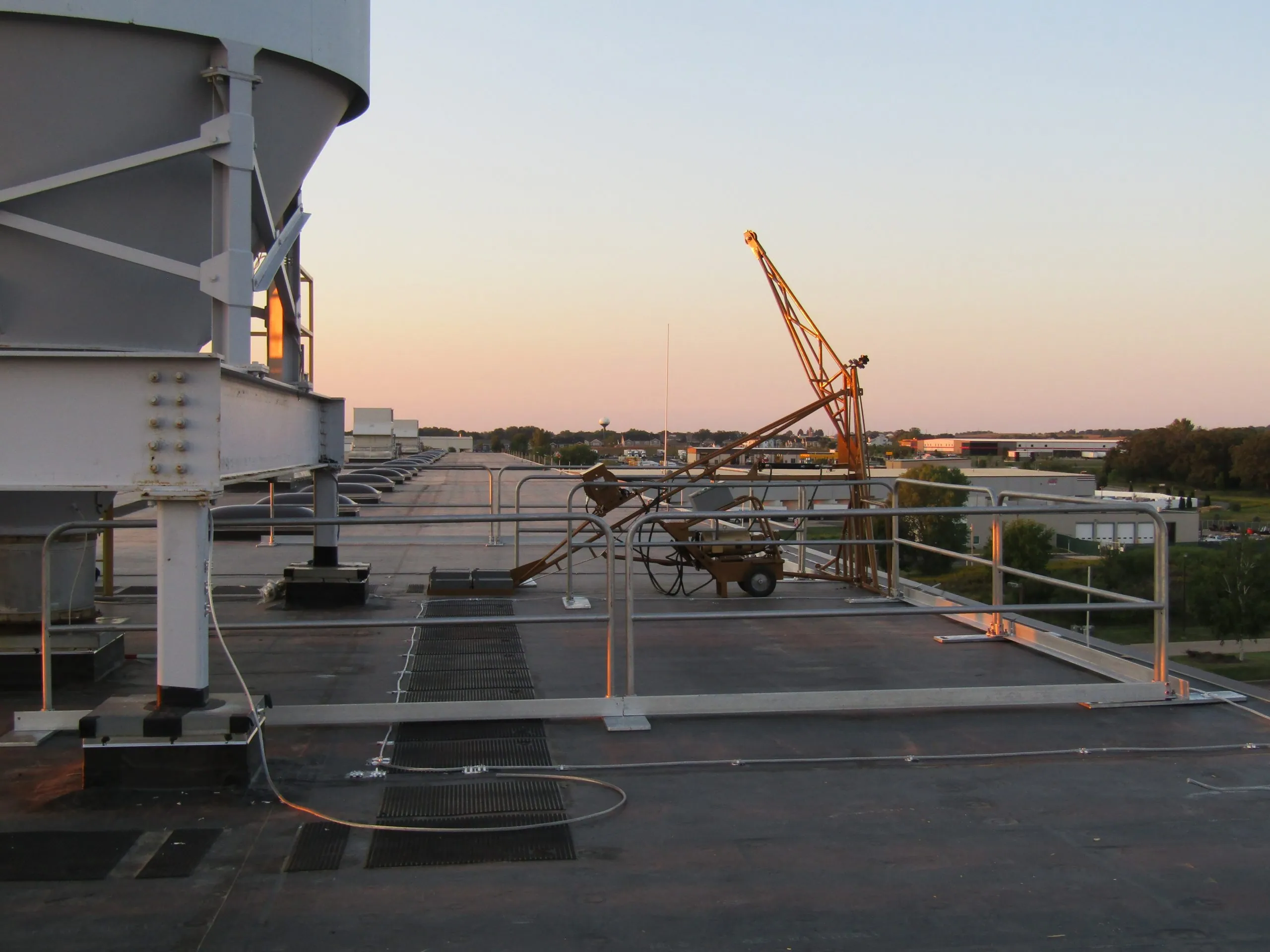Portable davit arm system set up for confined space entry and rescue