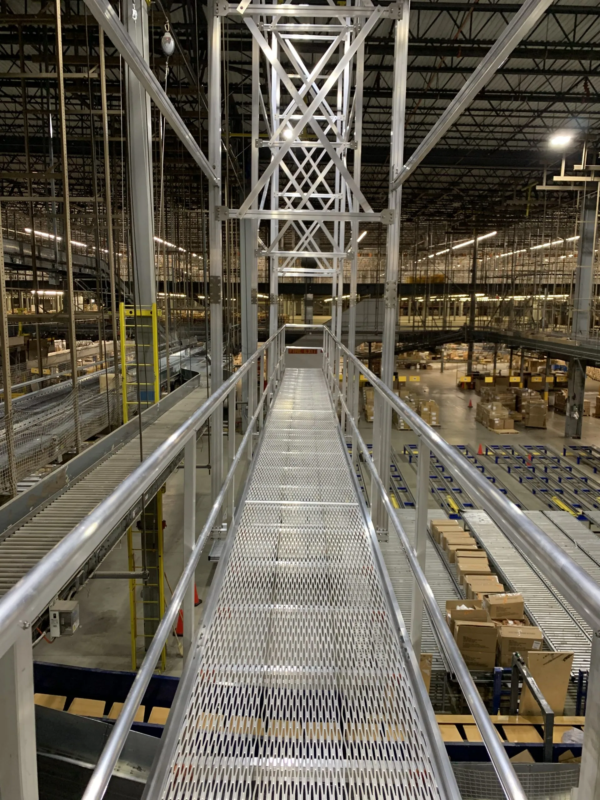 Elevated catwalk system providing safe access across industrial facility