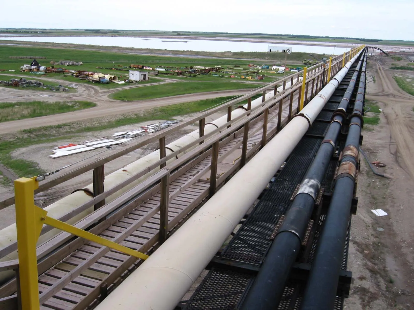 Fall protection system installed for elevated access along industrial pipe rack