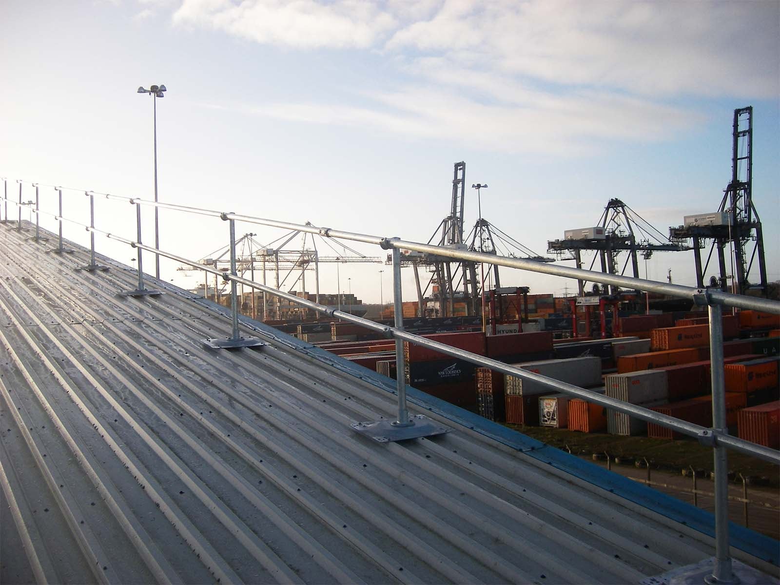 Guardrail system installed on metal roof for fall hazard prevention