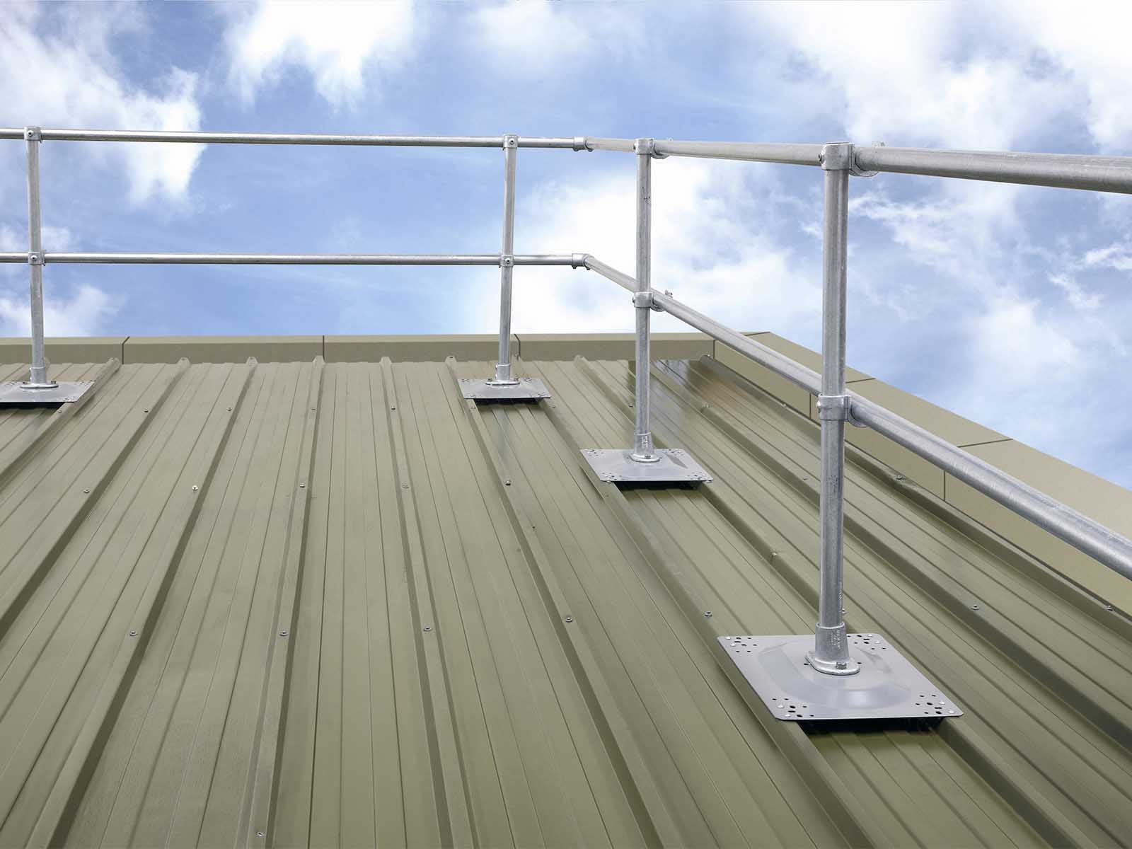Guardrail system installed on metal roof for fall hazard prevention