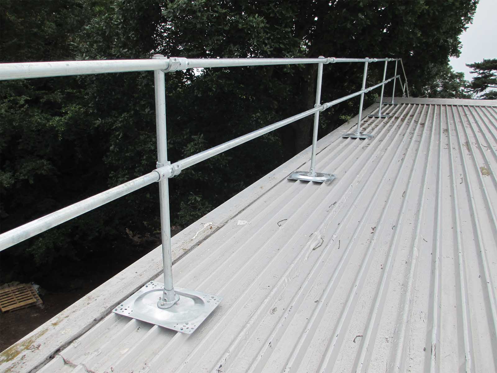 Guardrail system installed on metal roof for fall hazard prevention