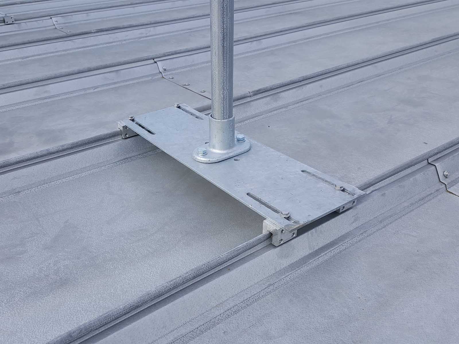 Guardrail system installed on metal roof for fall hazard prevention