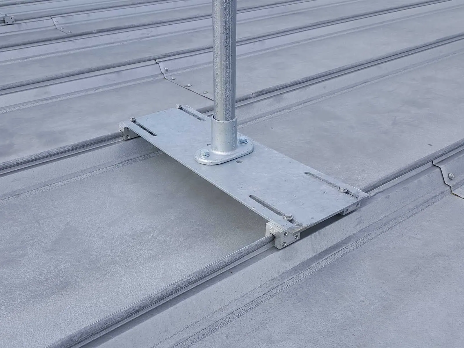 Guardrail system installed on metal roof for fall hazard prevention