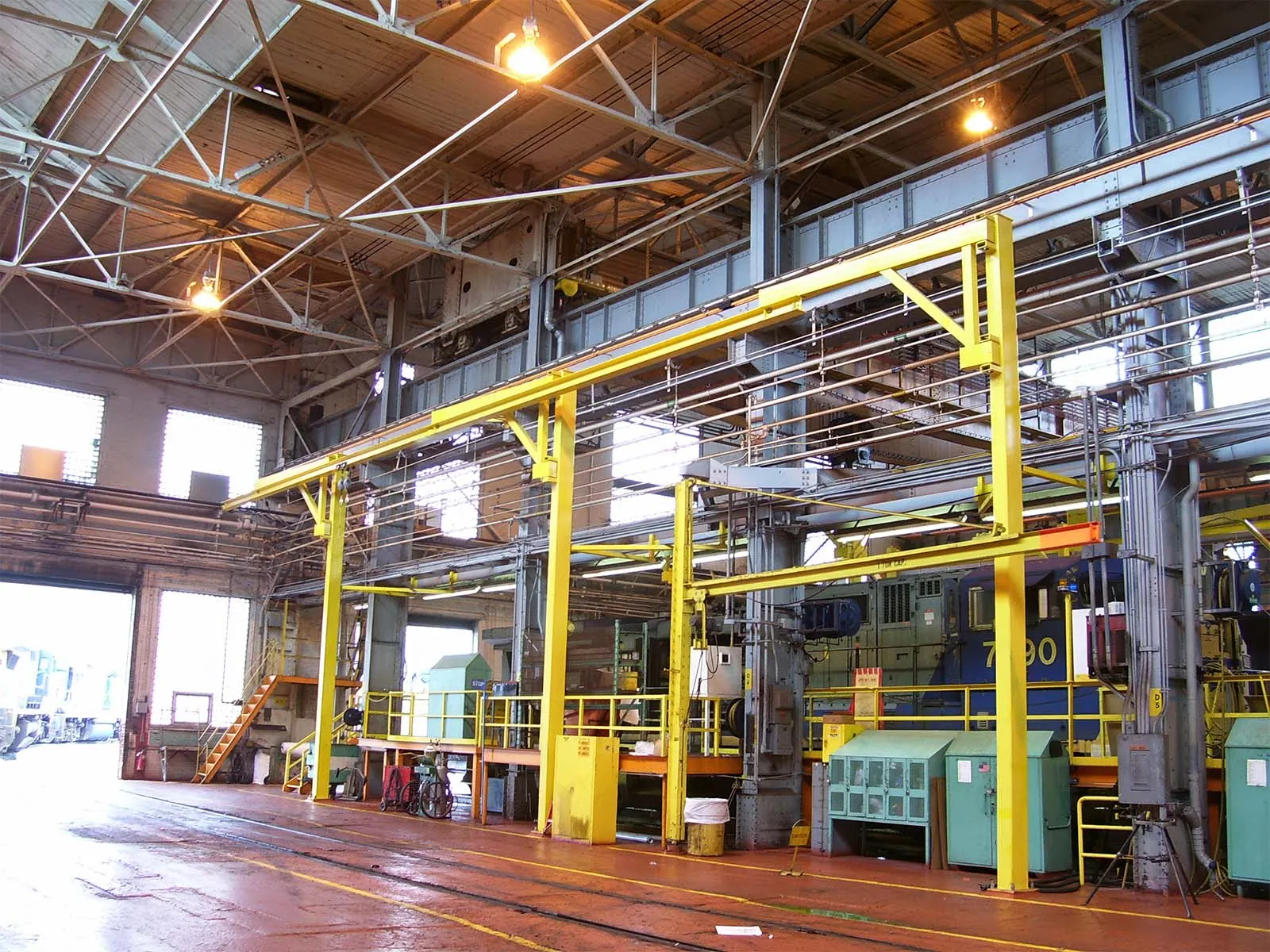 Engineered overhead crane system with integrated fall arrest safety features