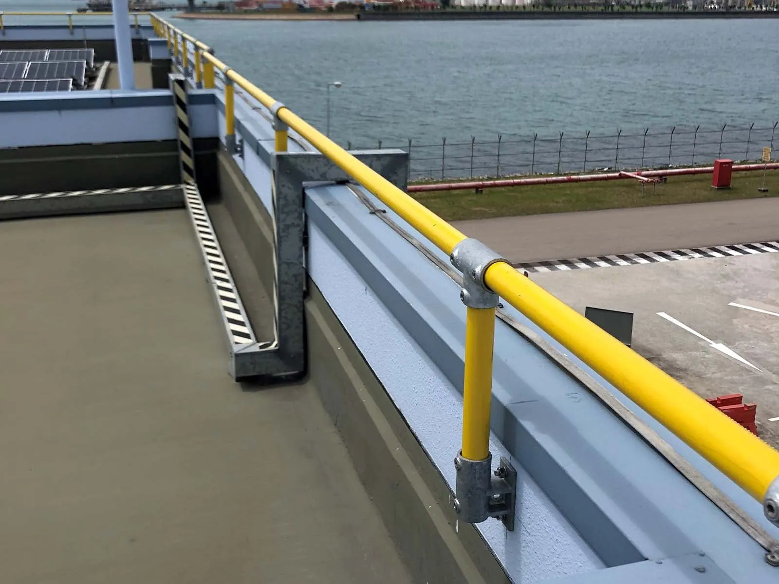 Parapet guardrail system installed on rooftop edge for fall protection