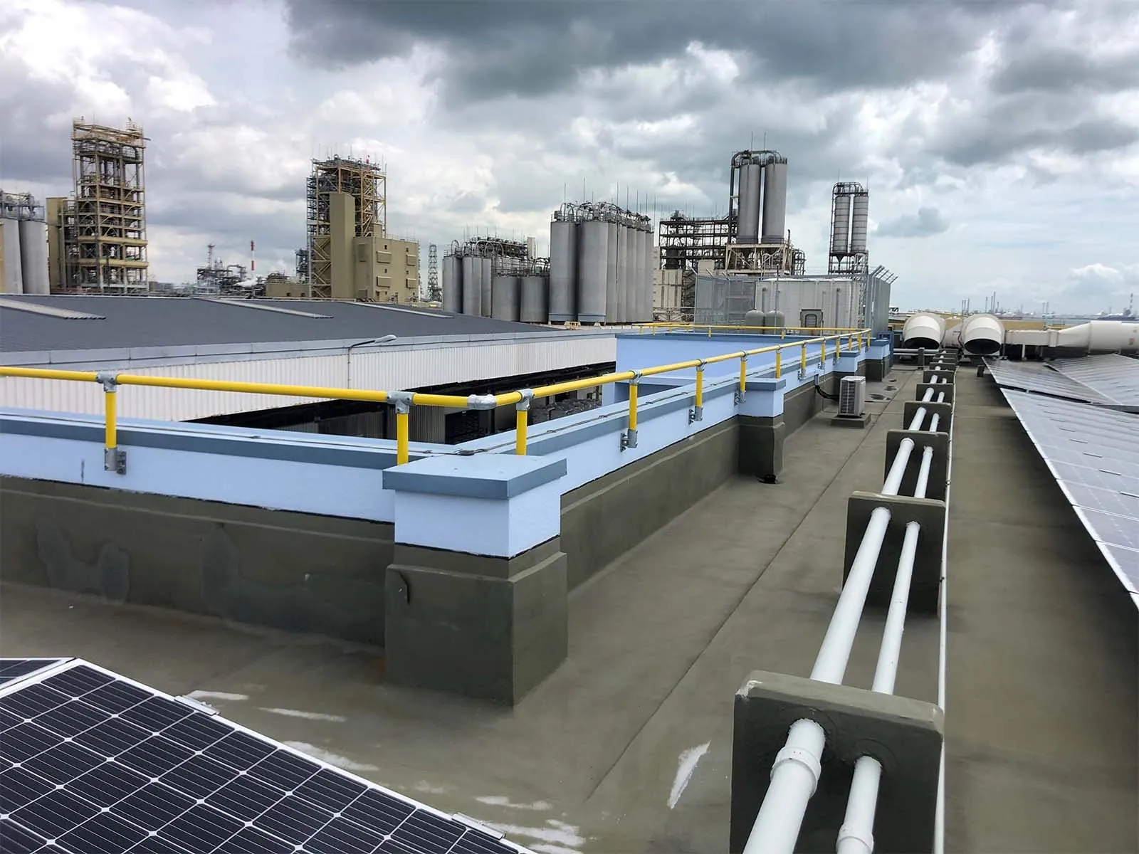 Parapet guardrail system installed on rooftop edge for fall protection