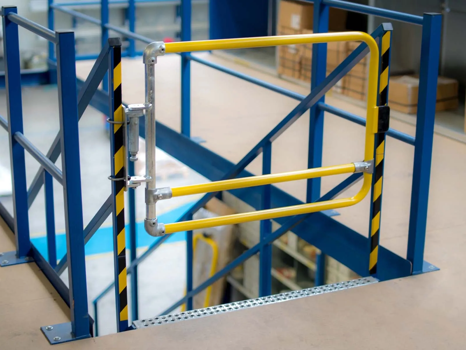 Self-closing safety gate installed for fall protection on elevated platforms and stairways