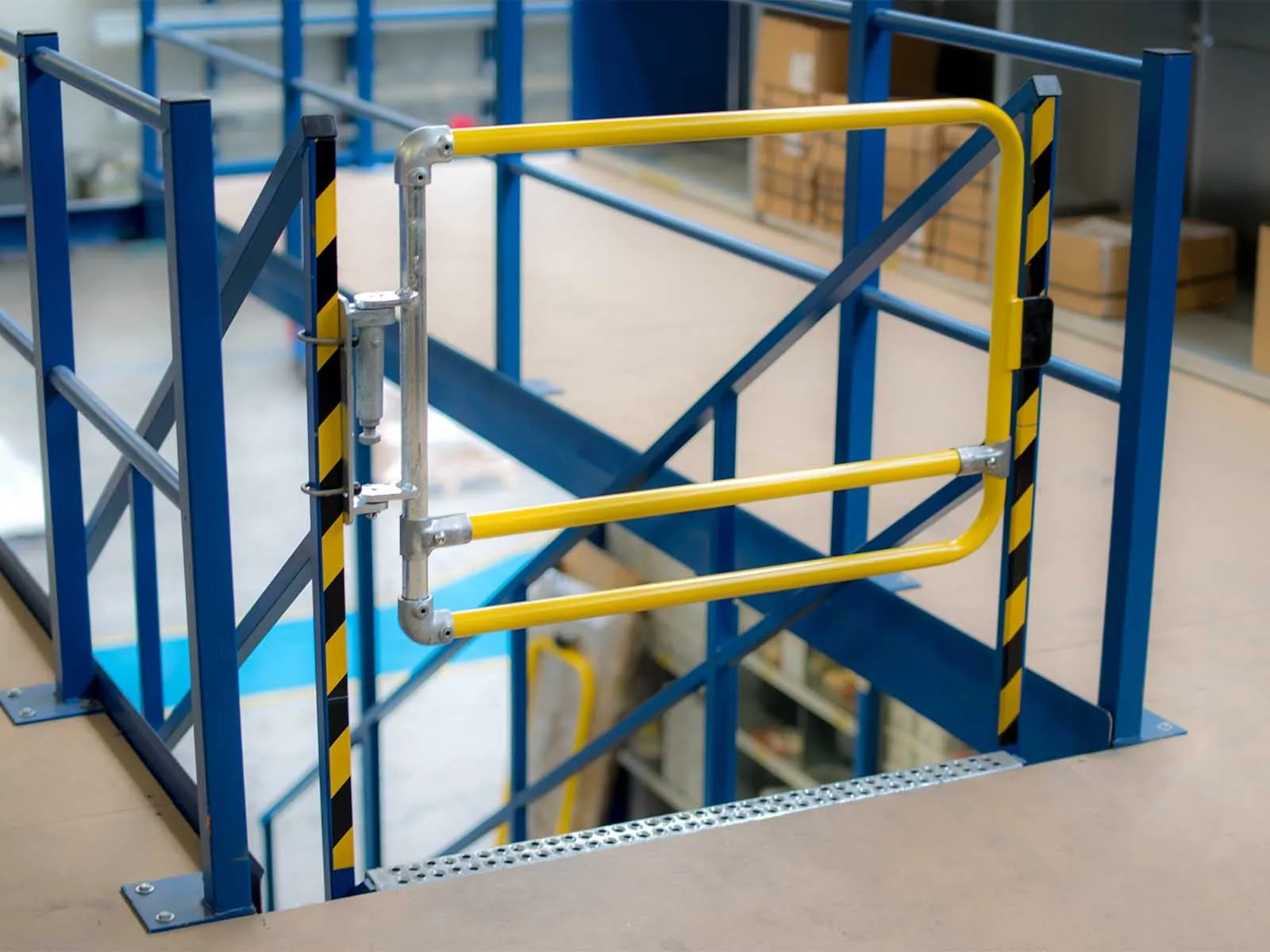Self-closing safety gate installed for fall protection on elevated platforms and stairways