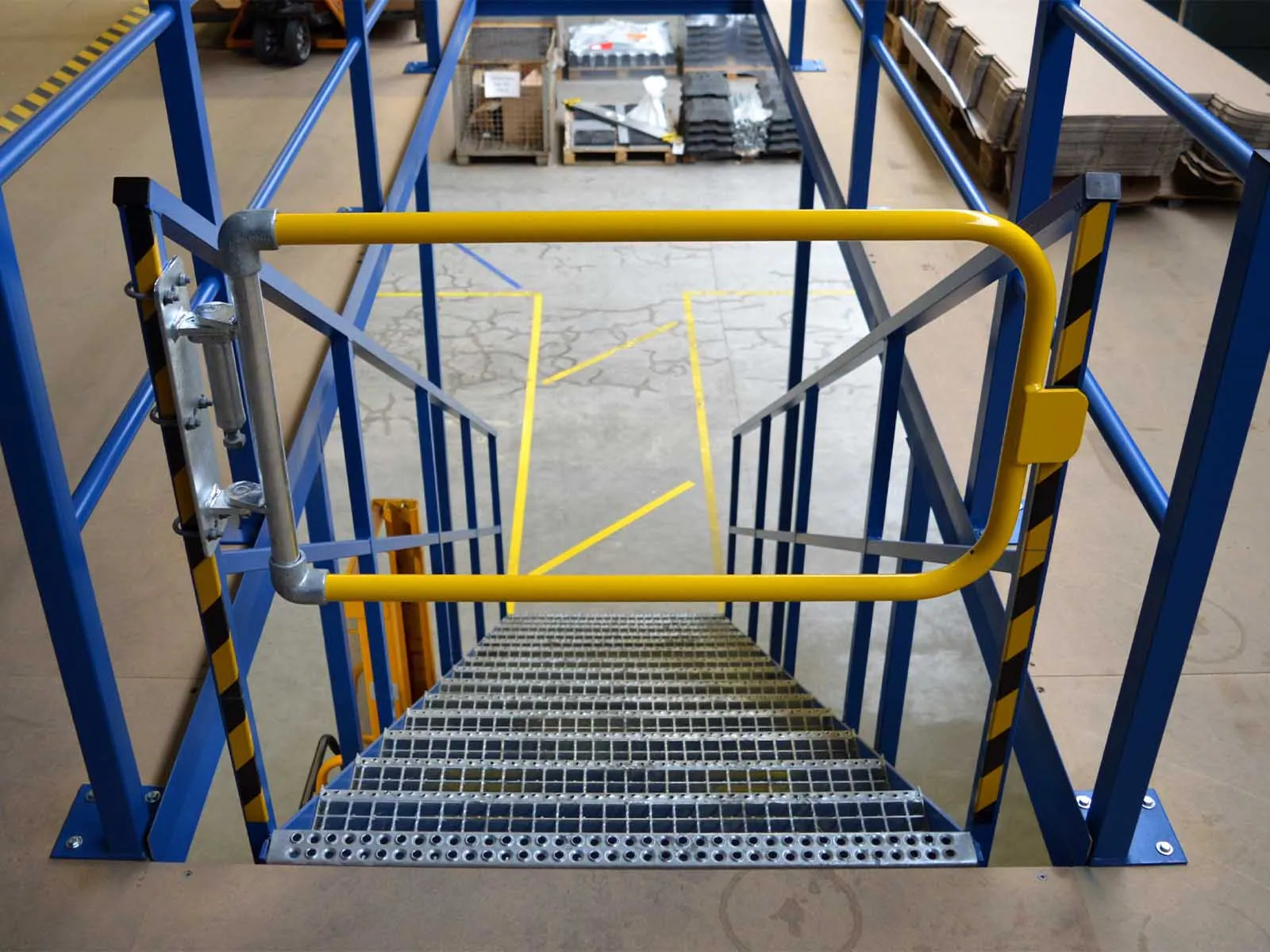 Self-closing safety gate installed for fall protection on elevated platforms and stairways