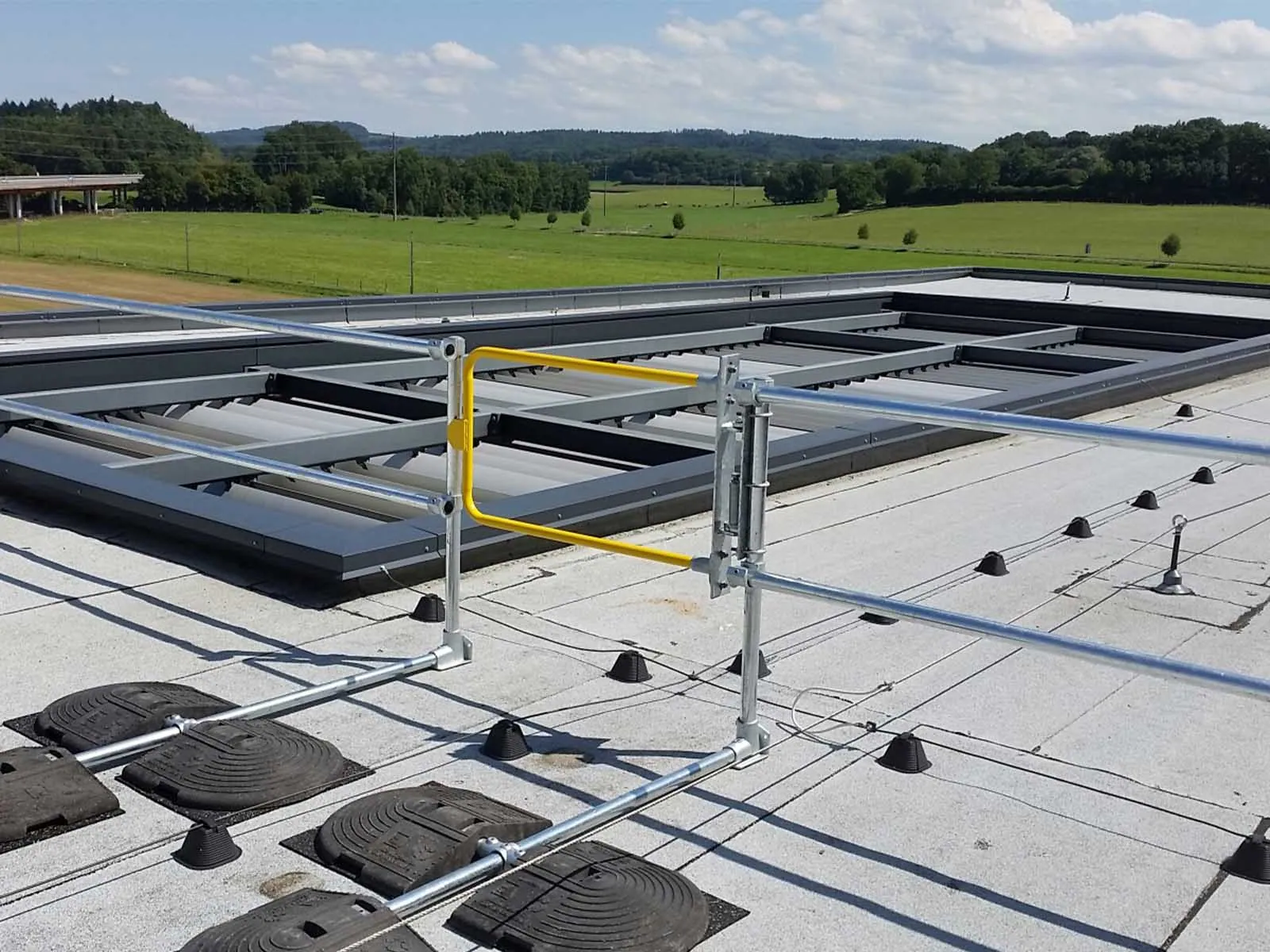 Self-closing safety gate installed for fall protection on elevated platforms and stairways