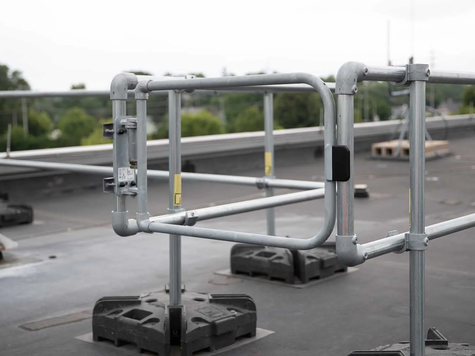 Self-closing safety gate installed for fall protection on elevated platforms and stairways