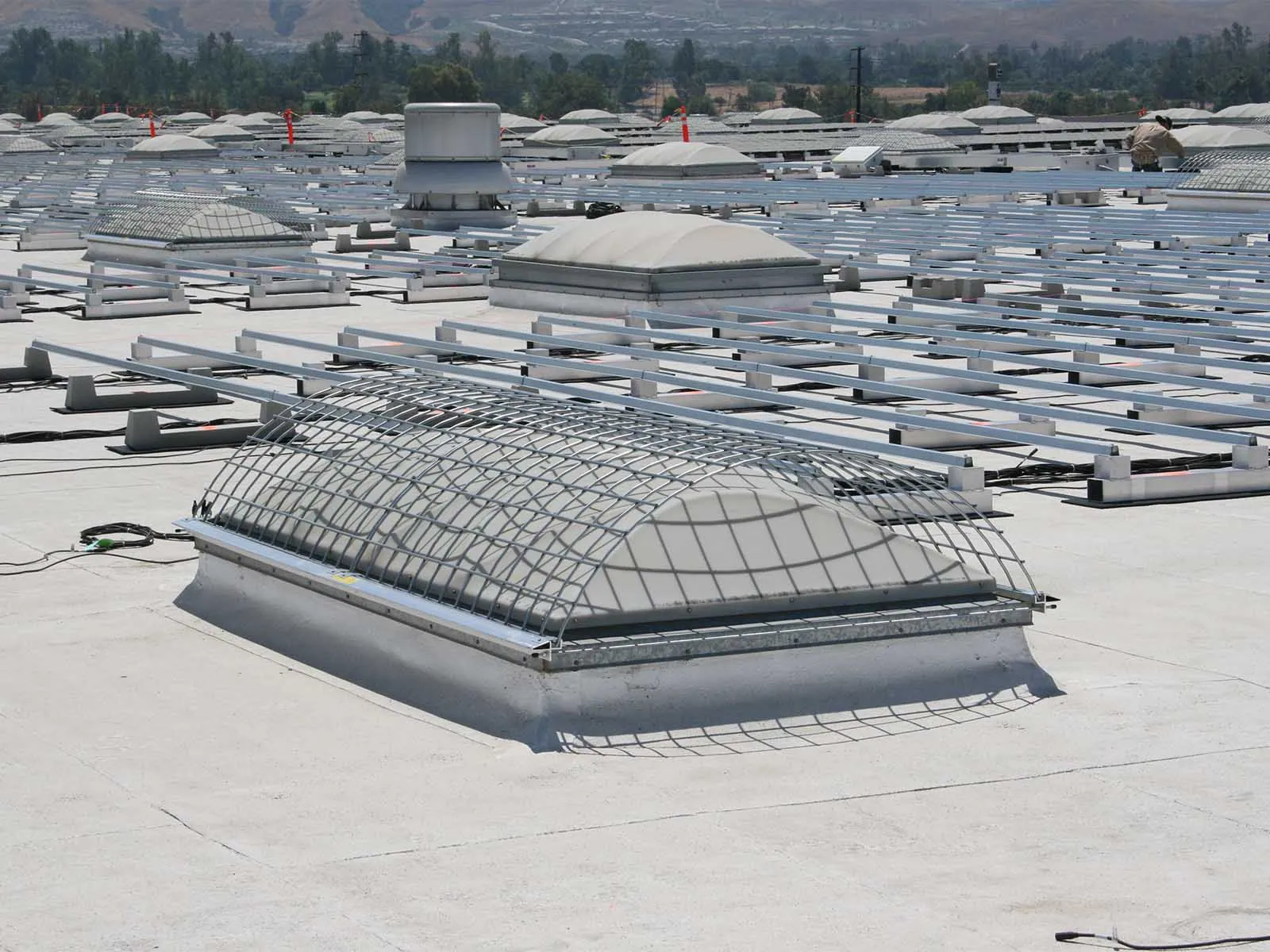 Durable skylight cover installed to prevent falls and protect rooftop openings