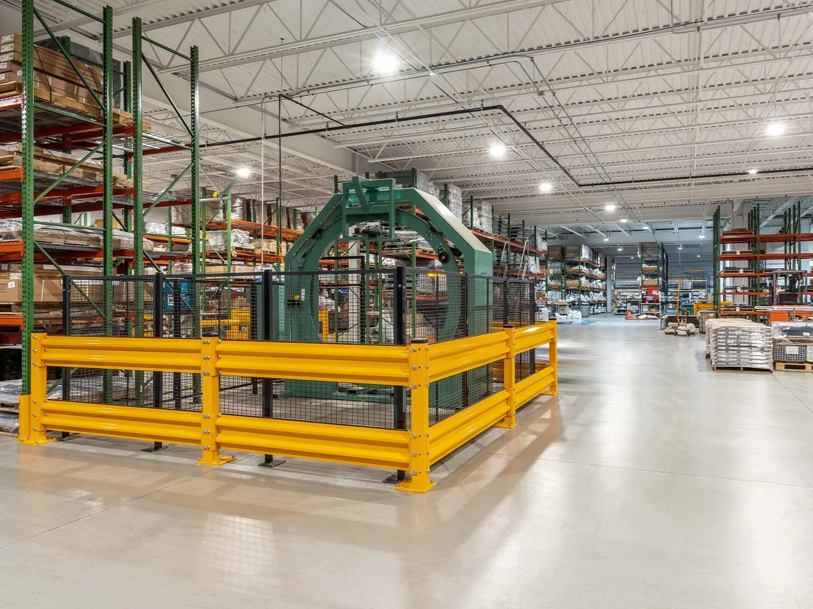 Warehouse traffic barriers installed to protect pedestrians and equipment in busy warehouse environment