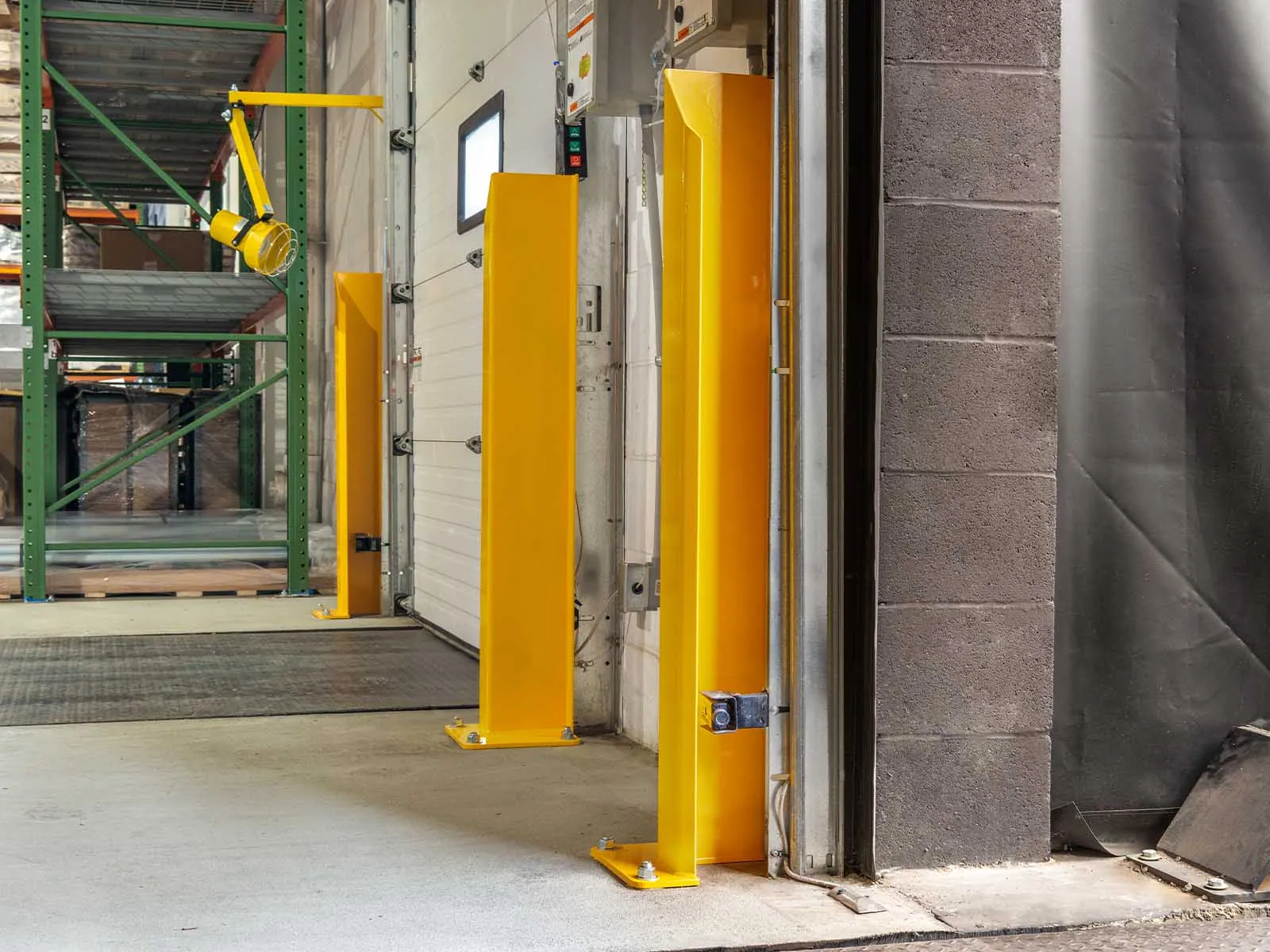 Warehouse traffic barriers installed to protect pedestrians and equipment in busy warehouse environment