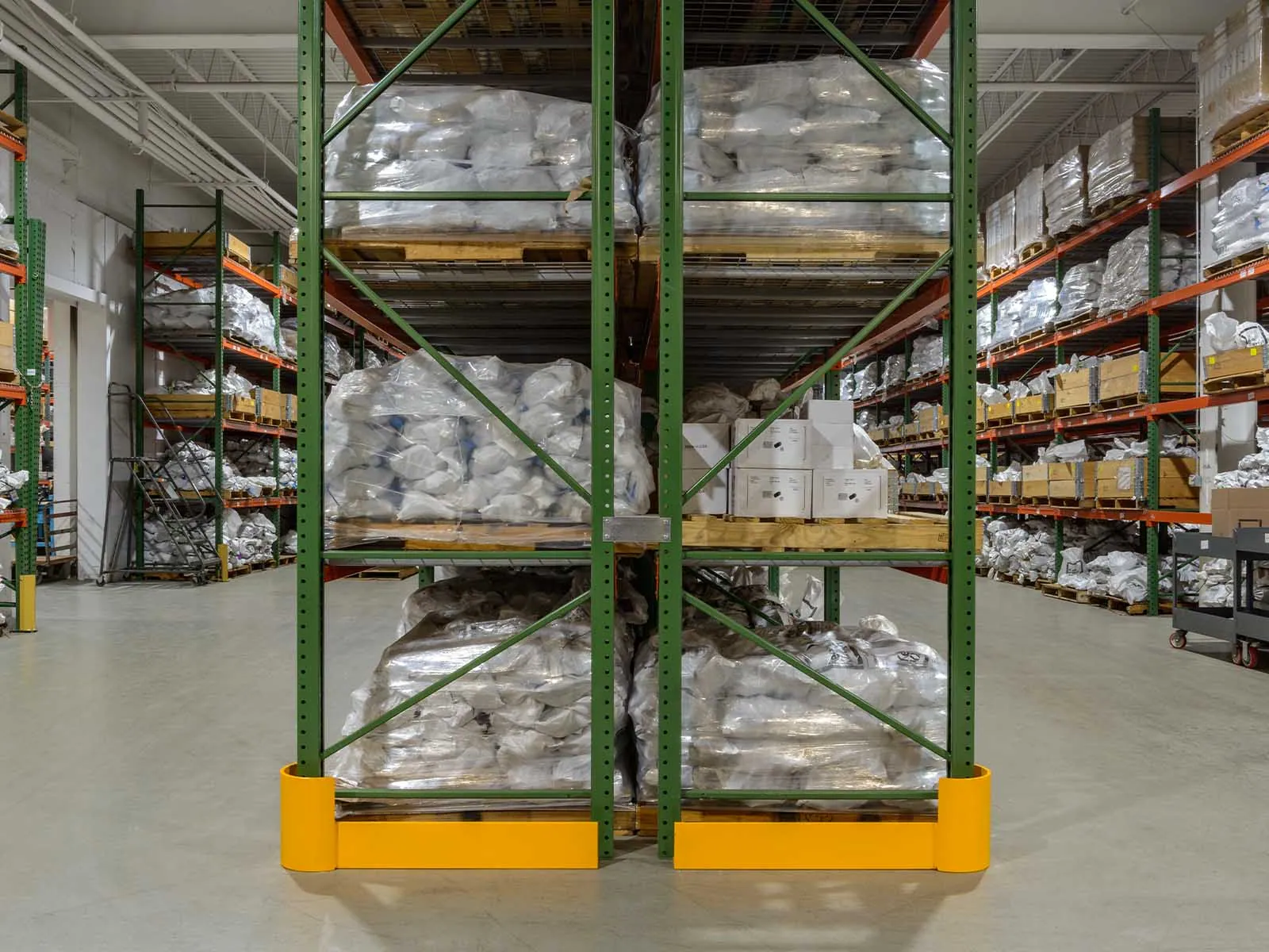 Warehouse traffic barriers installed to protect pedestrians and equipment in busy warehouse environment