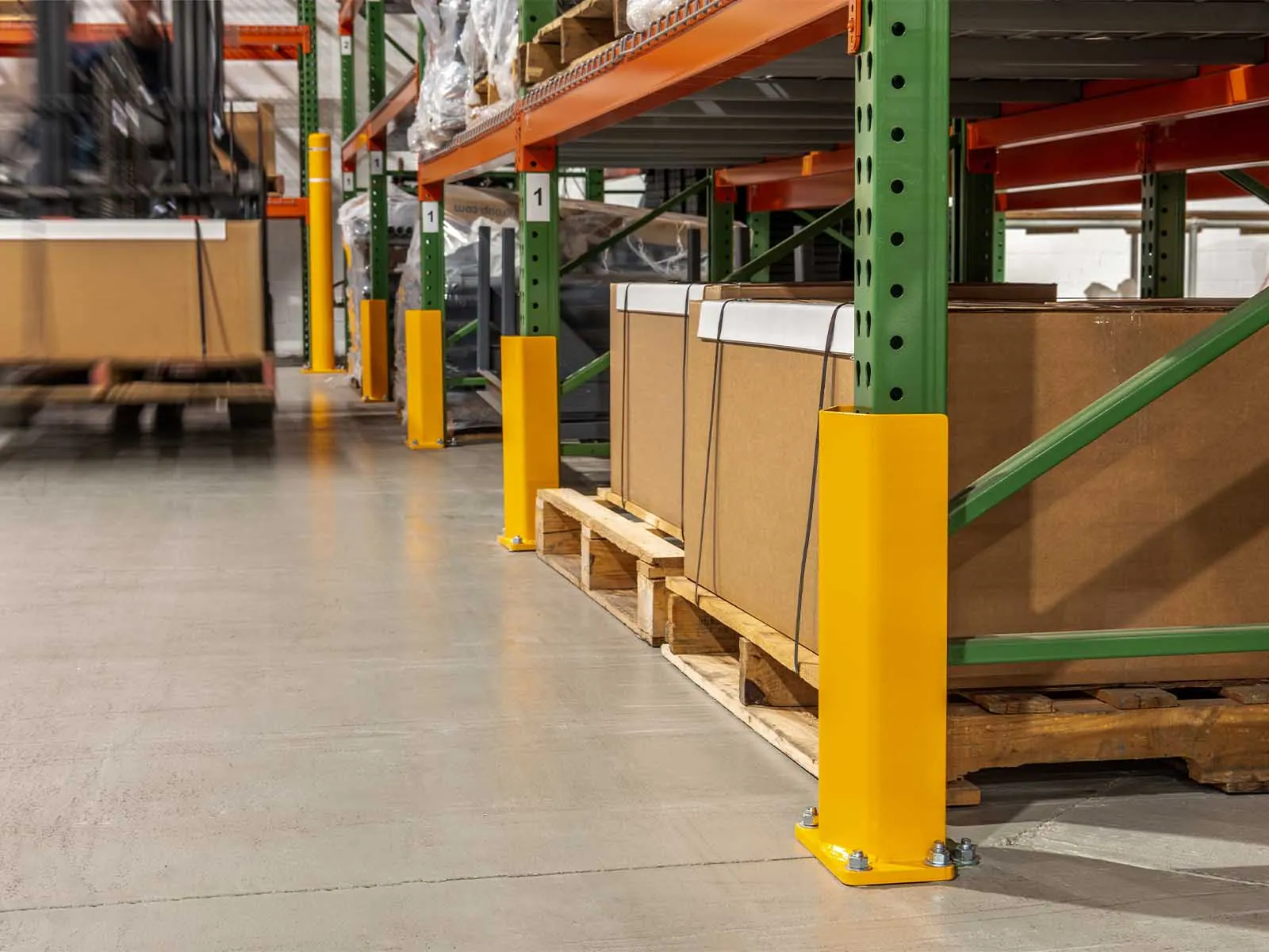 Warehouse traffic barriers installed to protect pedestrians and equipment in busy warehouse environment