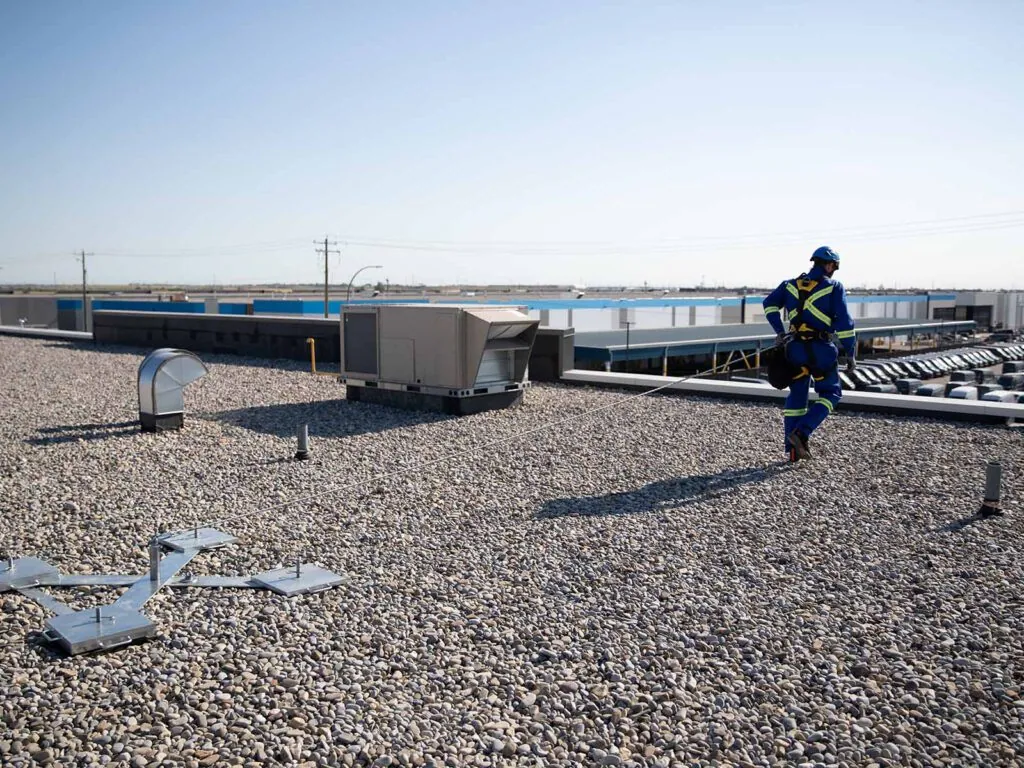 Weighted anchor system used for non-penetrating fall protection on rooftops