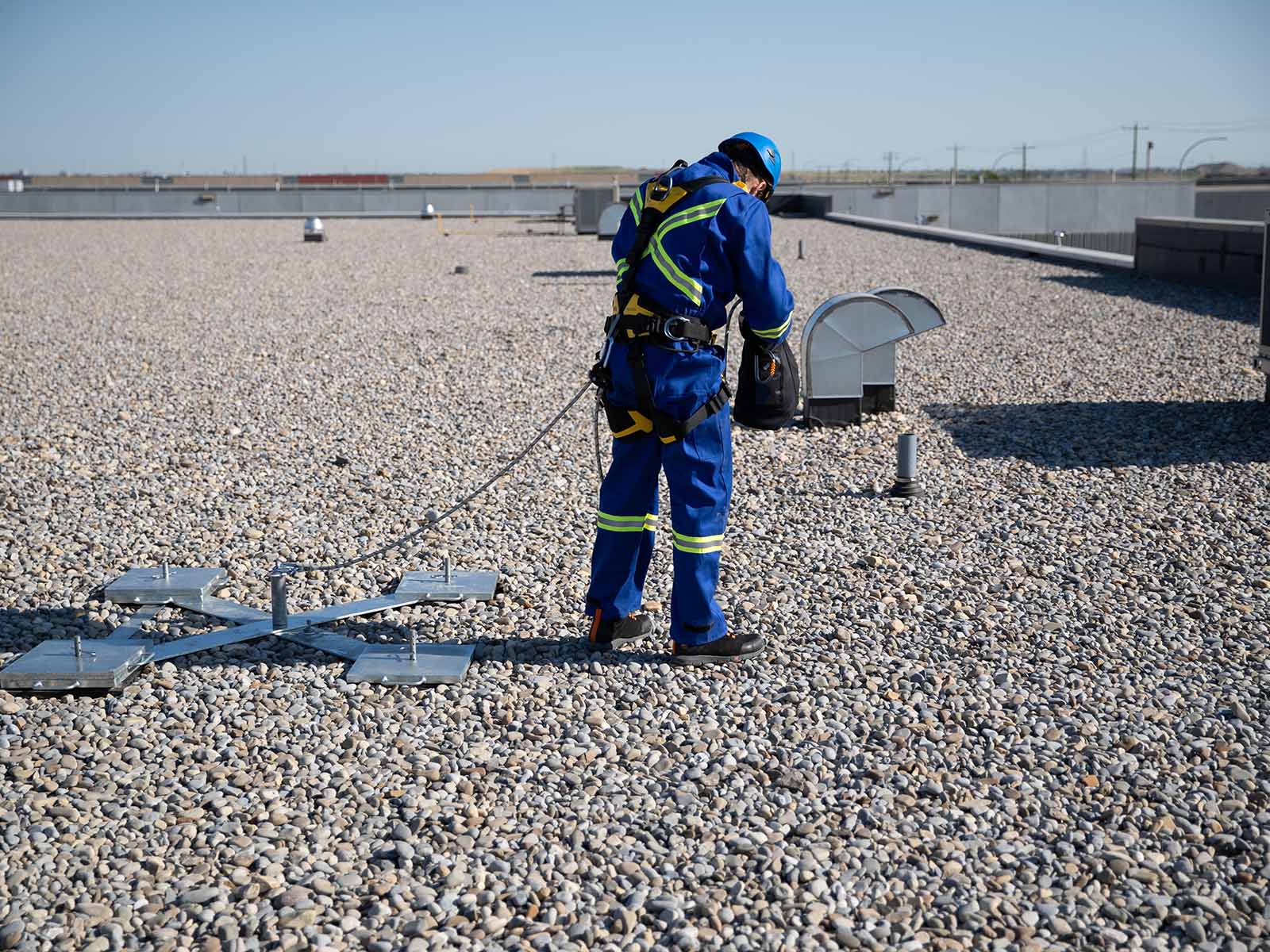 Weighted anchor system used for non-penetrating fall protection on rooftops