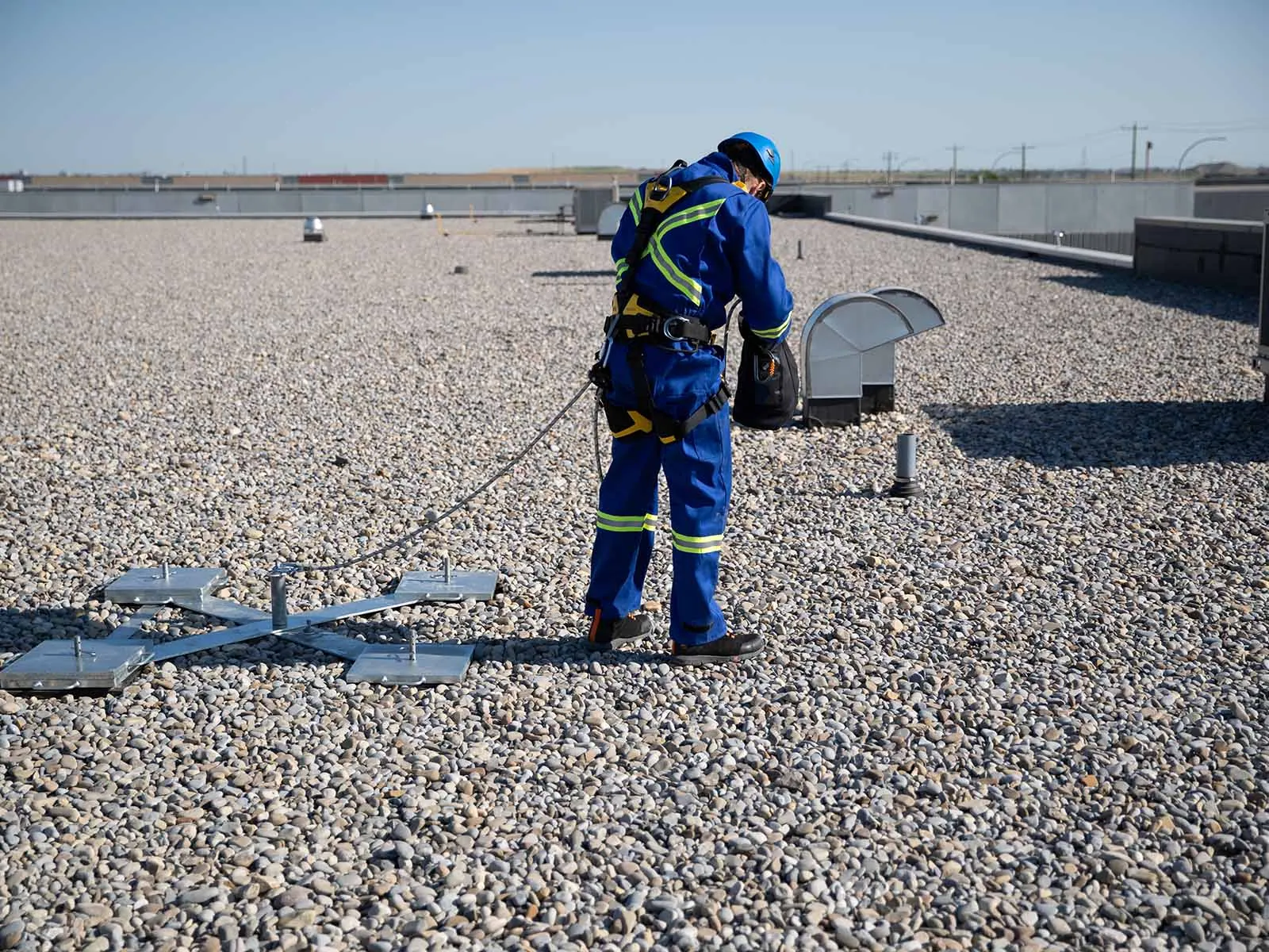 Weighted anchor system used for non-penetrating fall protection on rooftops