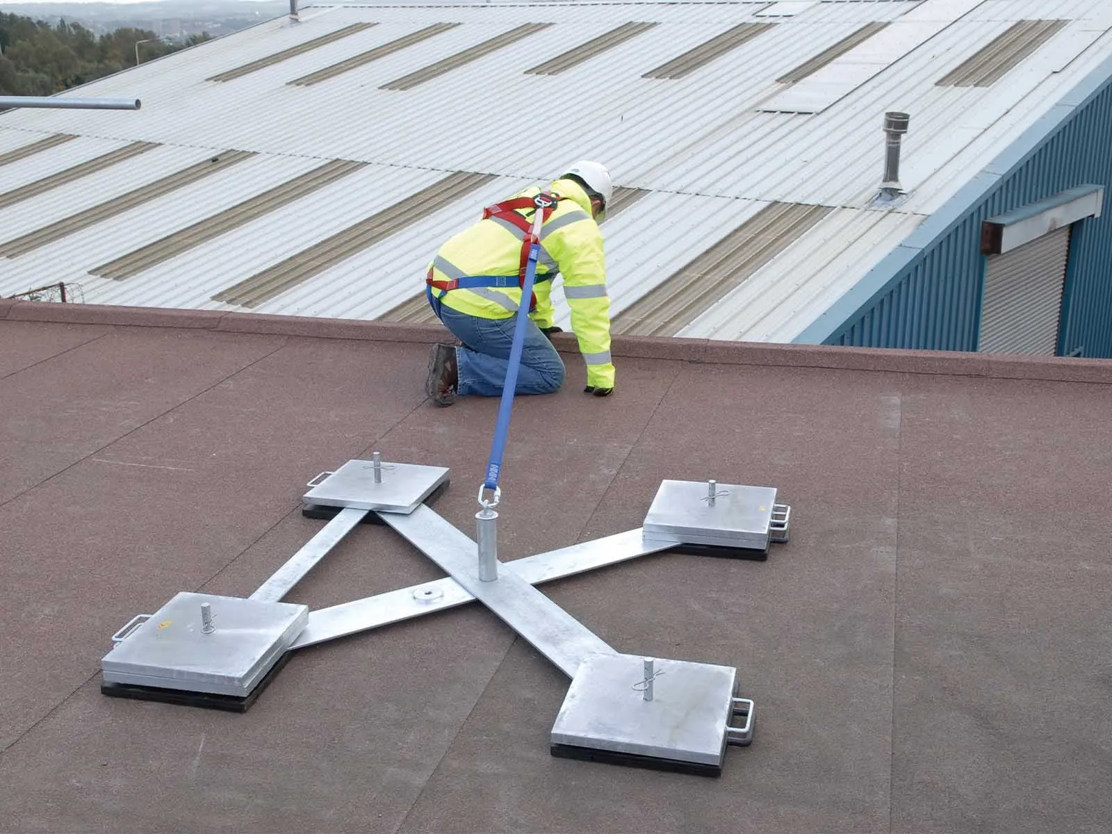 Weighted anchor system used for non-penetrating fall protection on rooftops