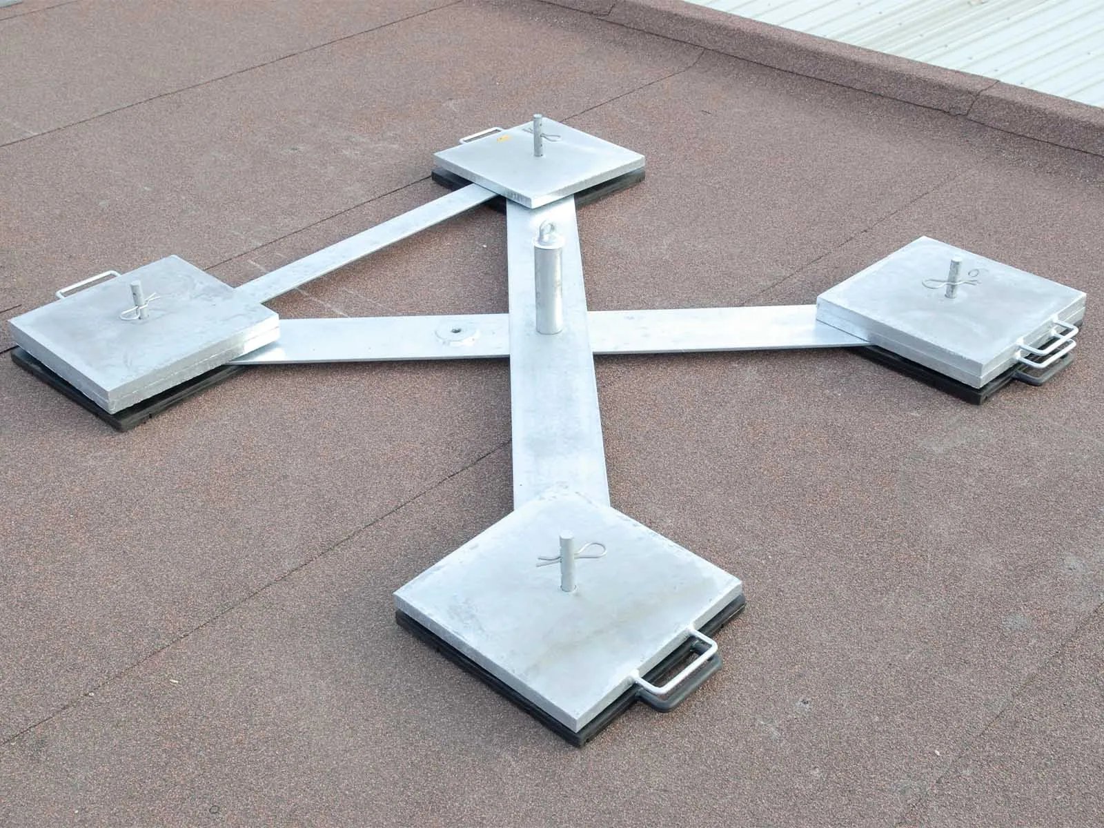 Weighted anchor system used for non-penetrating fall protection on rooftops