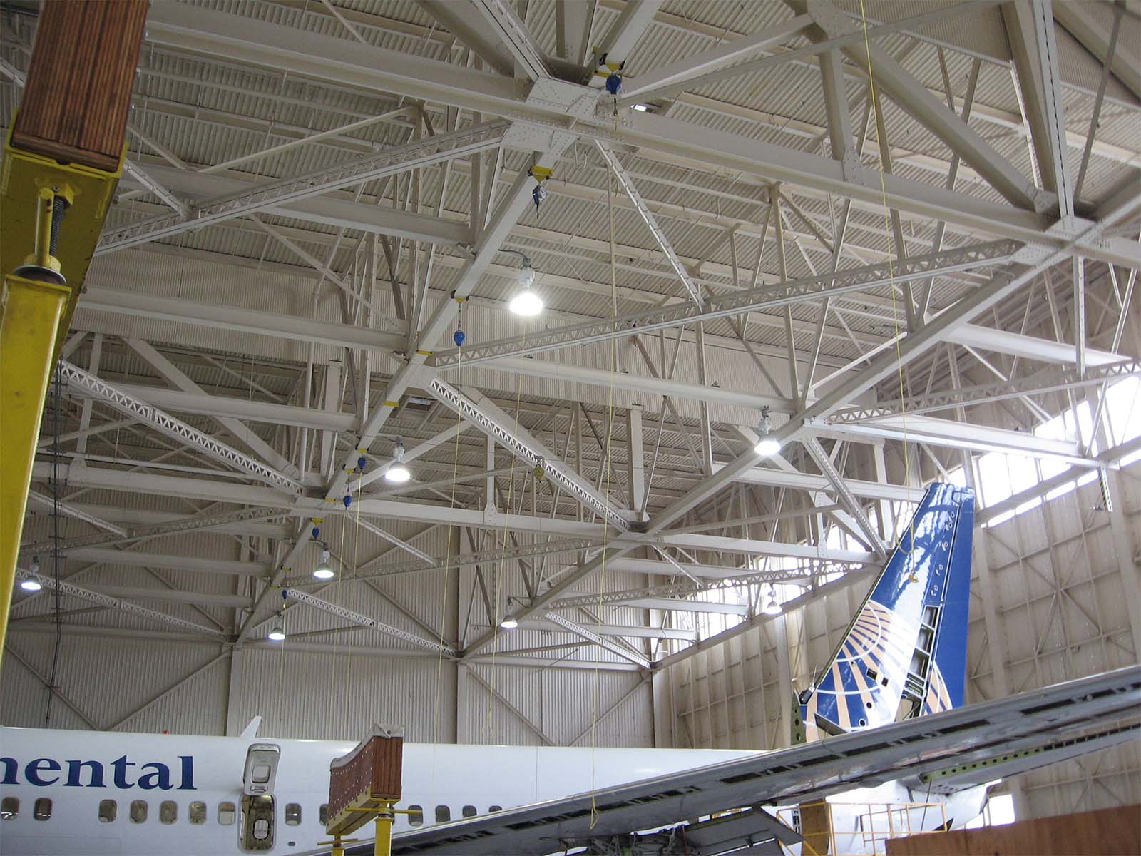 Fall protection system installed in aircraft hangar for aerospace maintenance operations